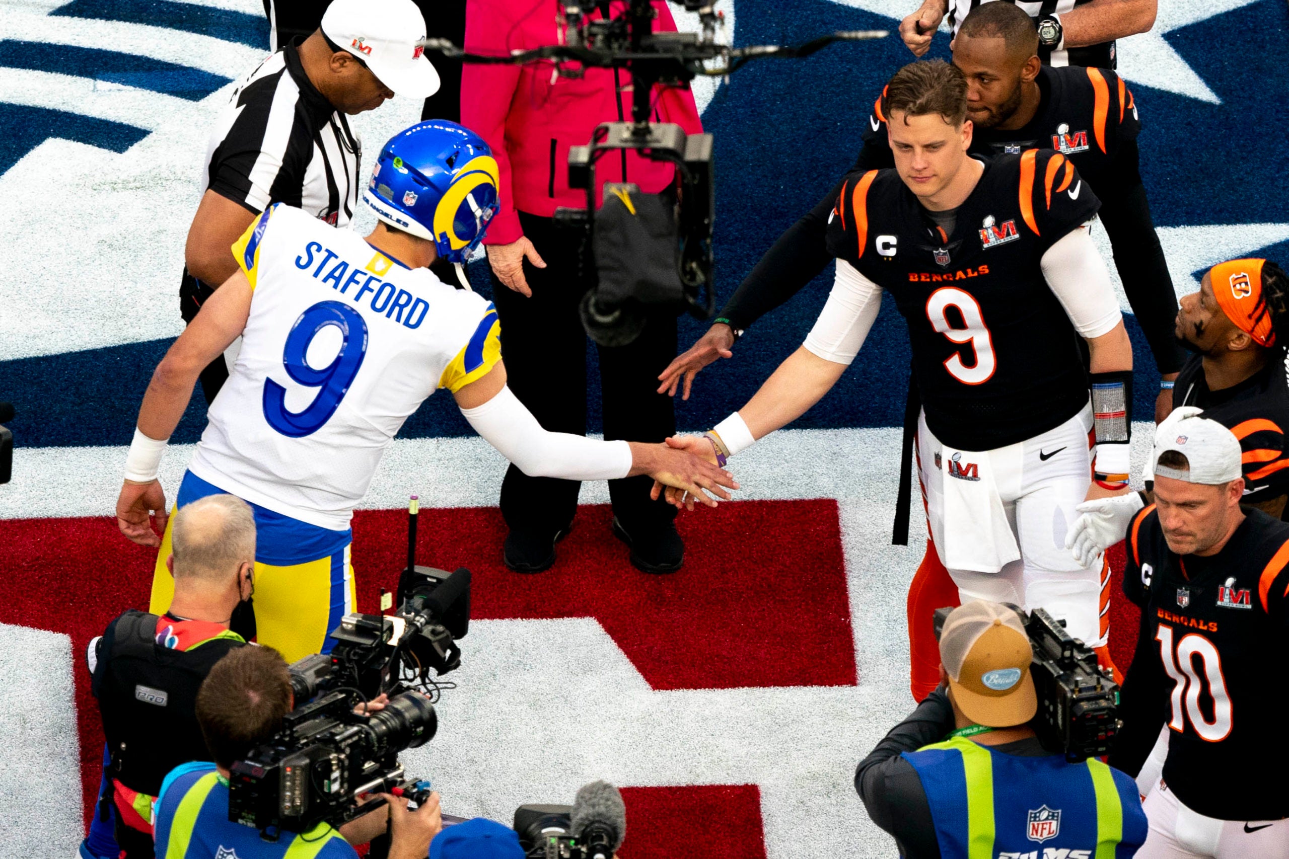 Feb 13, 2022; Inglewood, CA, USA;  Los Angeles Rams quarterback Matthew Stafford (9) shakes the hand of Cincinnati Bengals quarterback Joe Burrow (9) after Cincinnati Bengals won the coin toss during Super Bowl 56, Sunday, Feb. 13, 2022, at SoFi Stadium in Inglewood, Calif. Los Angeles Rams defeated Cincinnati Bengals 23-20.  Mandatory Credit: Albert Cesare-USA TODAY Sports