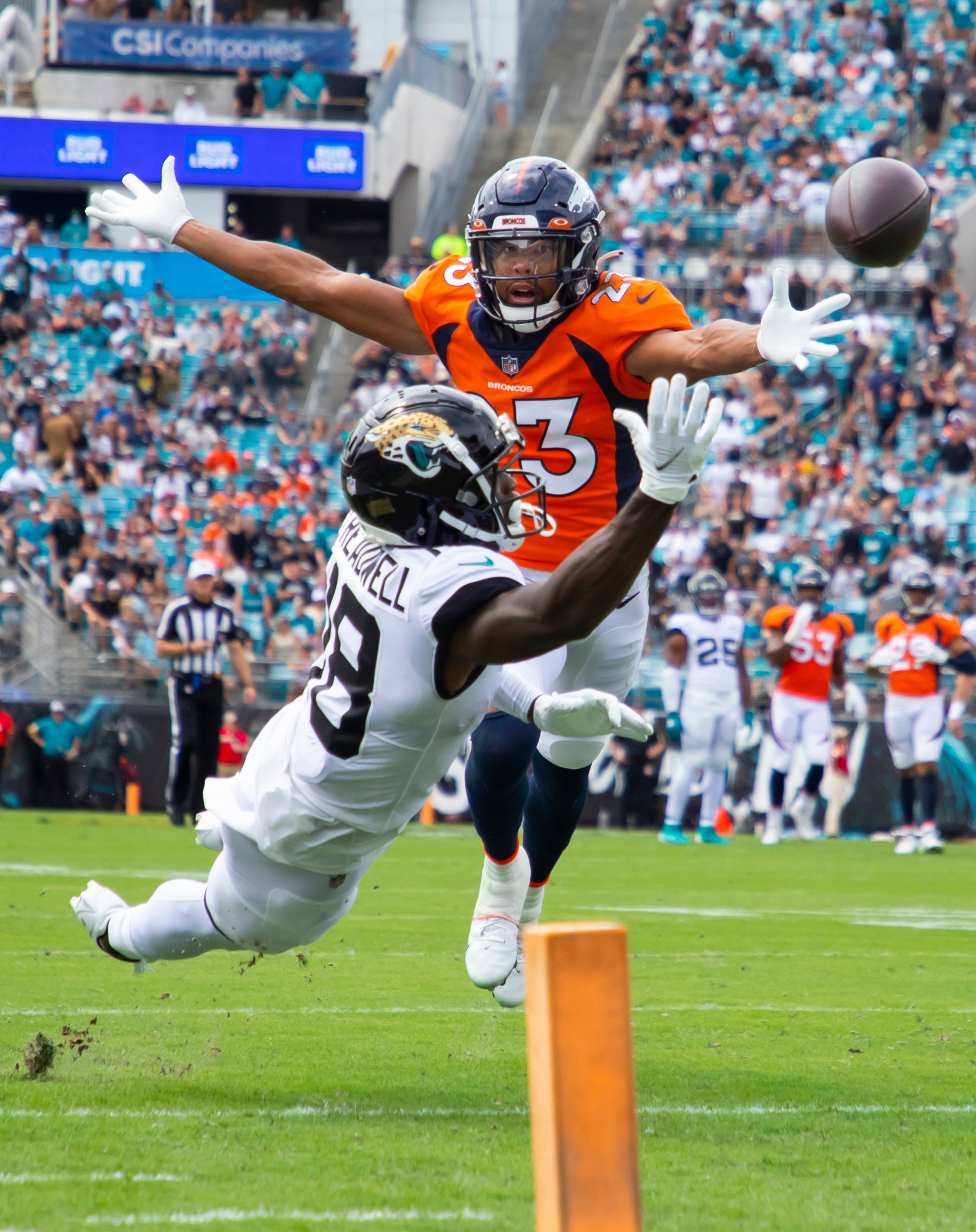 Sep 19, 2021; Jacksonville, Florida, USA; Jacksonville Jaguars wide receiver Laquon Treadwell (18) is unable to catch a pass against Denver Broncos cornerback Kyle Fuller (23) at TIAA Bank Field. Mandatory Credit: Mark J. Rebilas-USA TODAY Sports