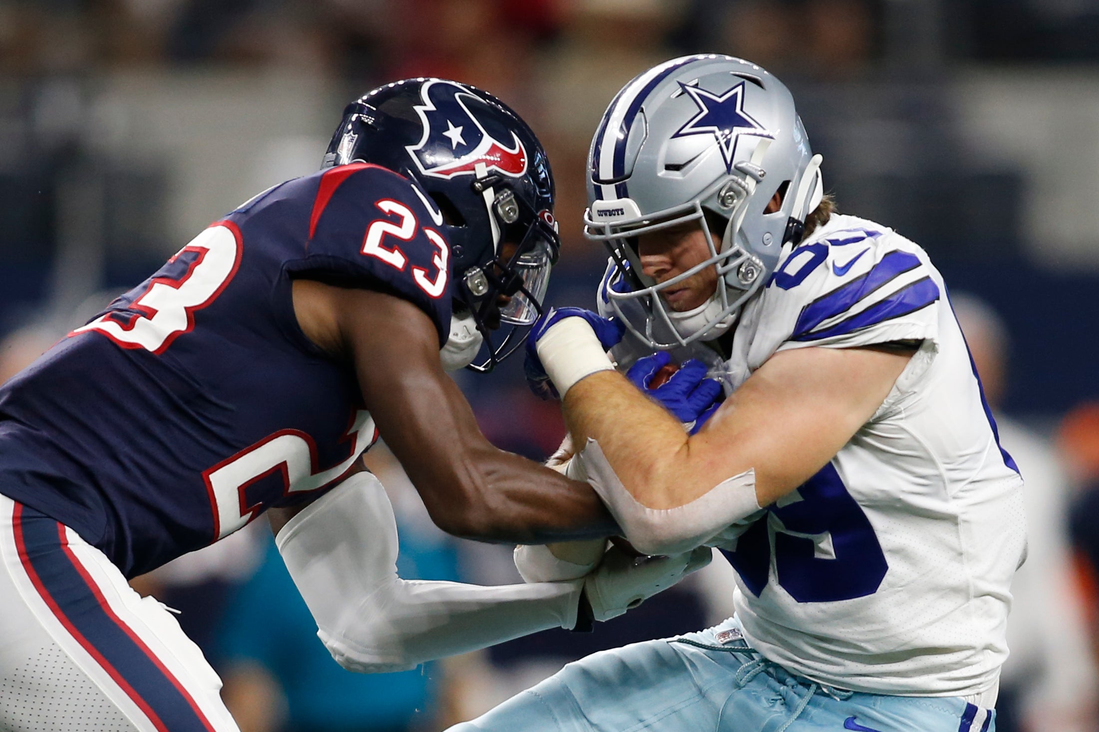Aug 21, 2021; Arlington, Texas, USA; Houston Texans strong safety Eric Murray (23) tackles Dallas Cowboys tight end Blake Jarwin (89) in the first quarter at AT&T Stadium. Mandatory Credit: Tim Heitman-USA TODAY Sports