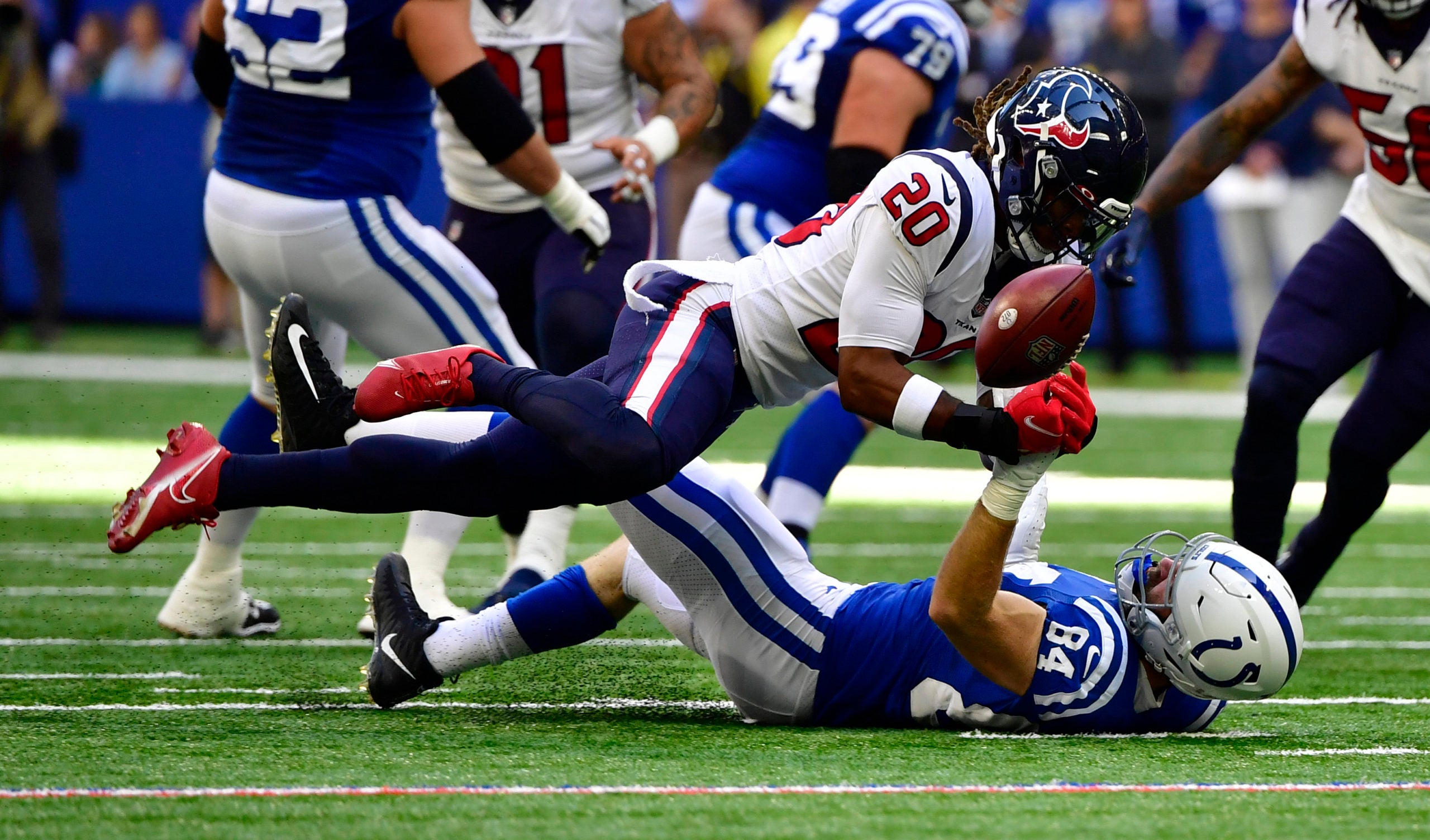 Oct 17, 2021; Indianapolis, Indiana, USA; Indianapolis Colts tight end Jack Doyle (84) misses a pass against Houston Texans safety Justin Reid (20) during the second quarter at Lucas Oil Stadium. Mandatory Credit: Marc Lebryk-USA TODAY Sports