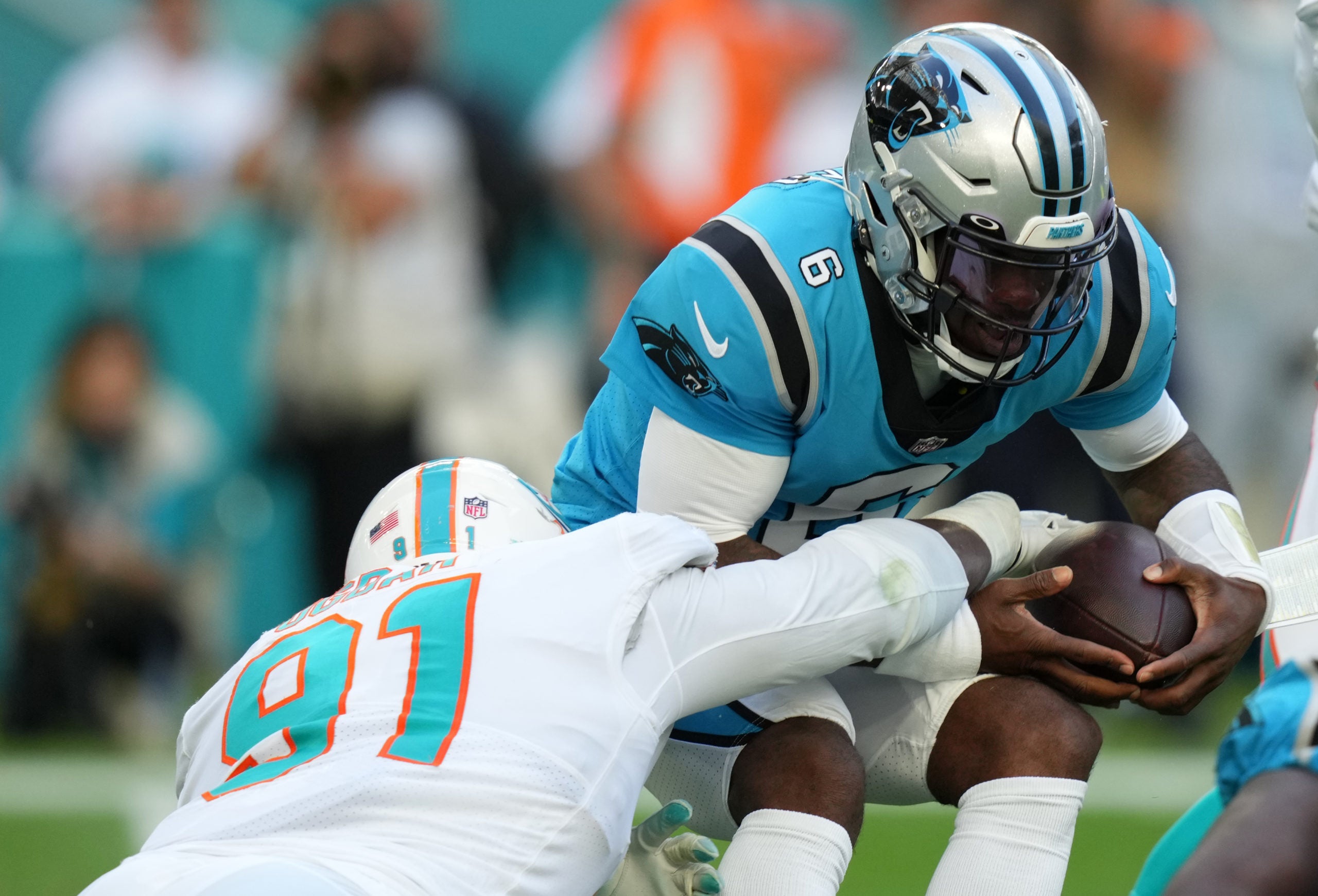Nov 28, 2021; Miami Gardens, Florida, USA; Miami Dolphins defensive end Emmanuel Ogbah (91) sacks Carolina Panthers quarterback P.J. Walker (6) during the second half at Hard Rock Stadium. Mandatory Credit: Jasen Vinlove-USA TODAY Sports