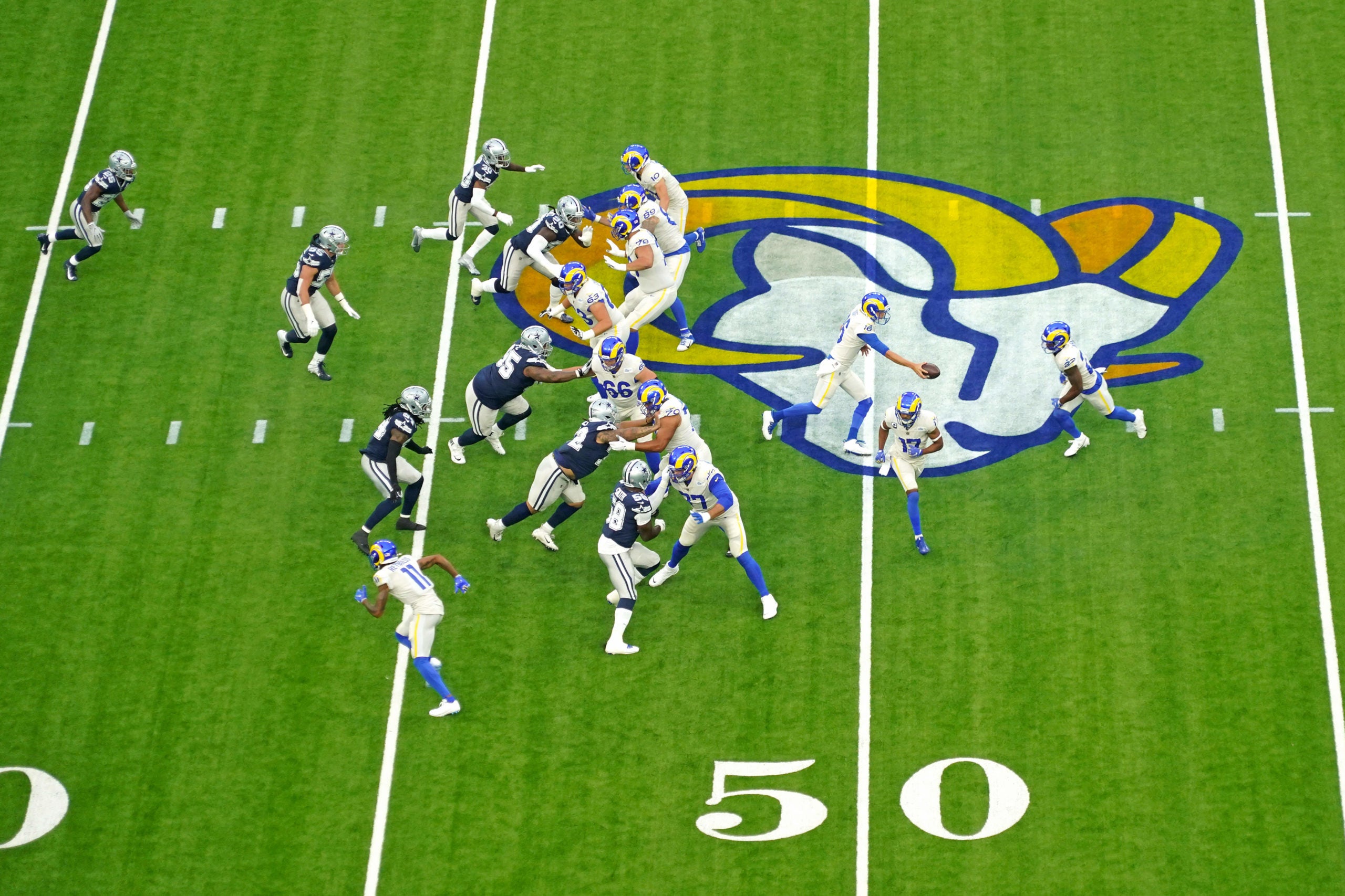Sep 13, 2020; Inglewood, California, USA; Los Angeles Rams quarterback Jared Goff (16) hands the ball off to Los Angeles Rams running back Malcolm Brown (34) during the first quarter against the Dallas Cowboys at SoFi Stadium. Mandatory Credit: Kirby Lee-USA TODAY Sports