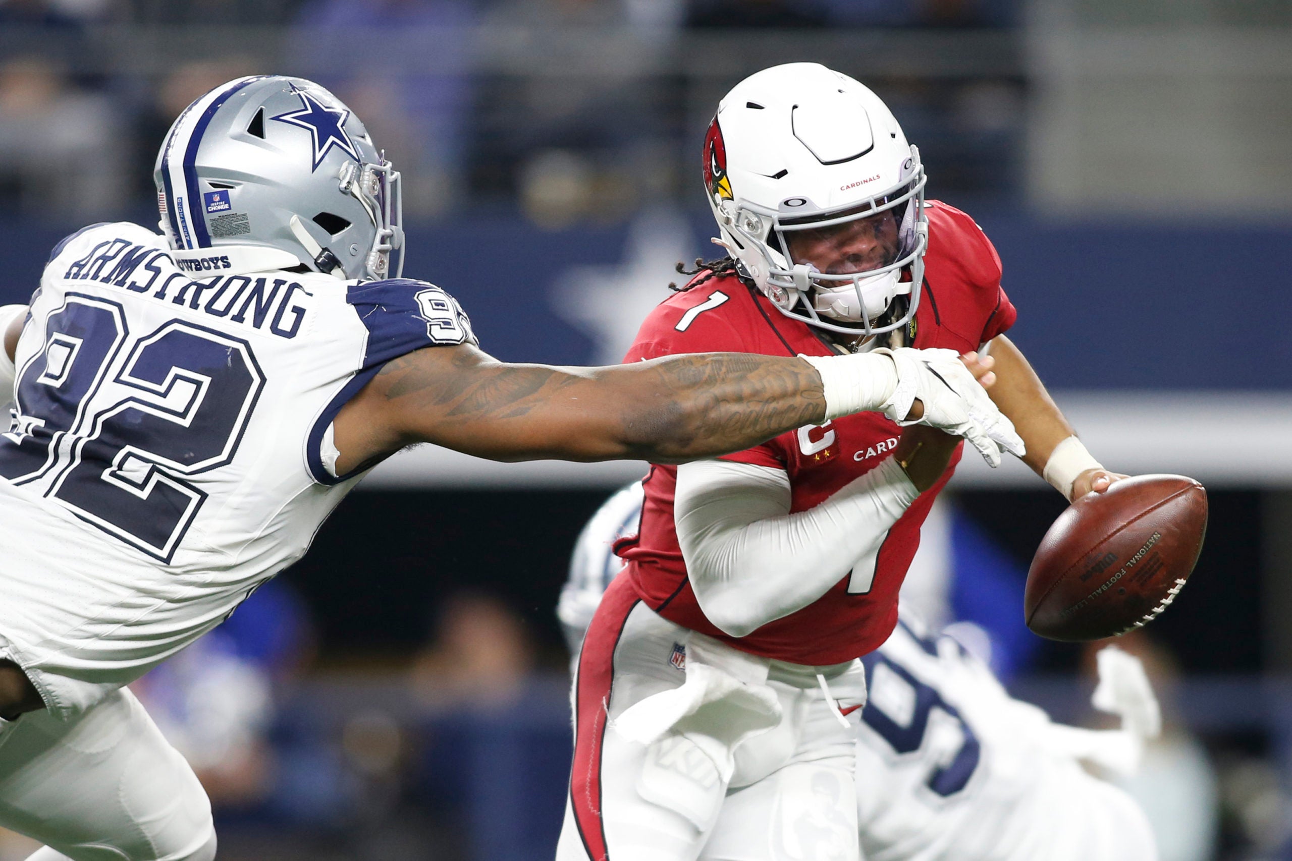 Jan 2, 2022; Arlington, Texas, USA; Arizona Cardinals quarterback Kyler Murray (1) is sacked by Dallas Cowboys defensive end Dorance Armstrong (92) in the third quarter at AT&T Stadium. Mandatory Credit: Tim Heitman-USA TODAY Sports