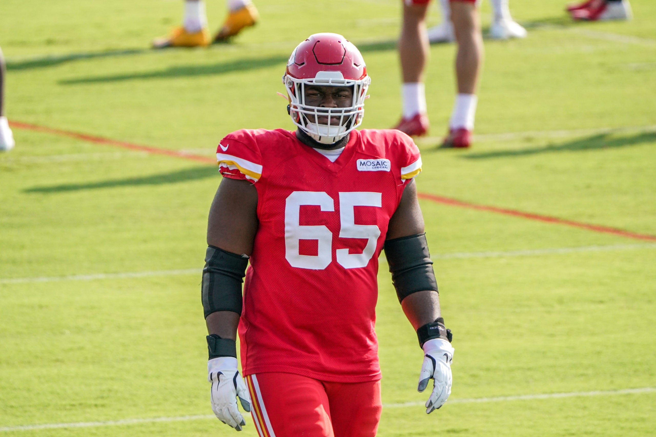 Aug 9, 2021; St. Joseph, MO, USA; Kansas City Chiefs offensive guard Trey Smith (65) runs drills during training camp at Missouri Western State University. Mandatory Credit: Denny Medley-USA TODAY Sports