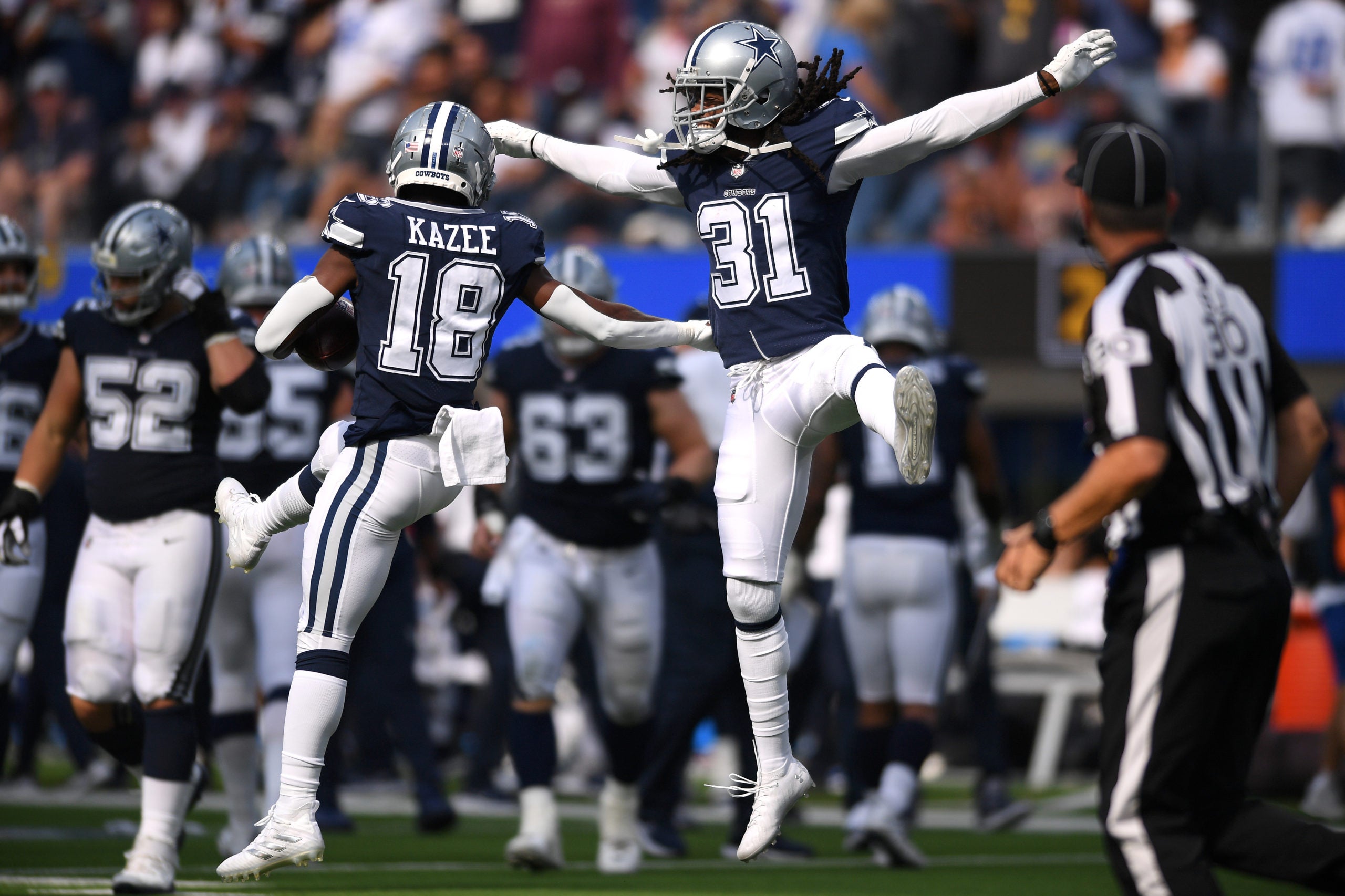 Sep 19, 2021; Inglewood, California, USA; Dallas Cowboys strong safety Damontae Kazee (18) celebrates with cornerback Maurice Canady (31) after an interception against the Los Angeles Chargers during the second half at SoFi Stadium. Mandatory Credit: Orlando Ramirez-USA TODAY Sports