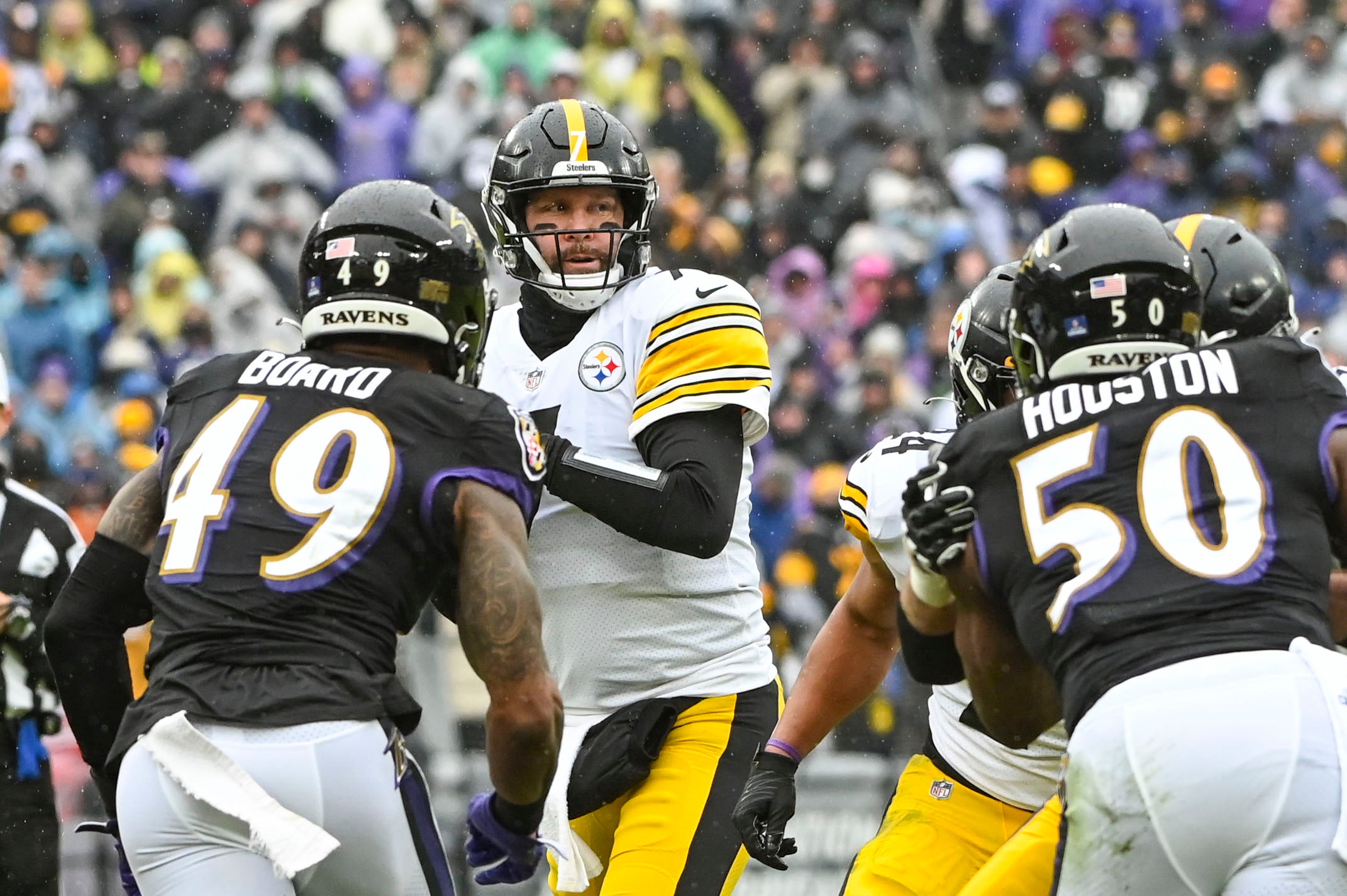 Jan 9, 2022; Baltimore, Maryland, USA; Pittsburgh Steelers quarterback Ben Roethlisberger (7) drops back to pass as Baltimore Ravens linebacker Chris Board (49) and outside linebacker Justin Houston (50) aplly pressure during the first quarter at M&T Bank Stadium. Mandatory Credit: Tommy Gilligan-USA TODAY Sports