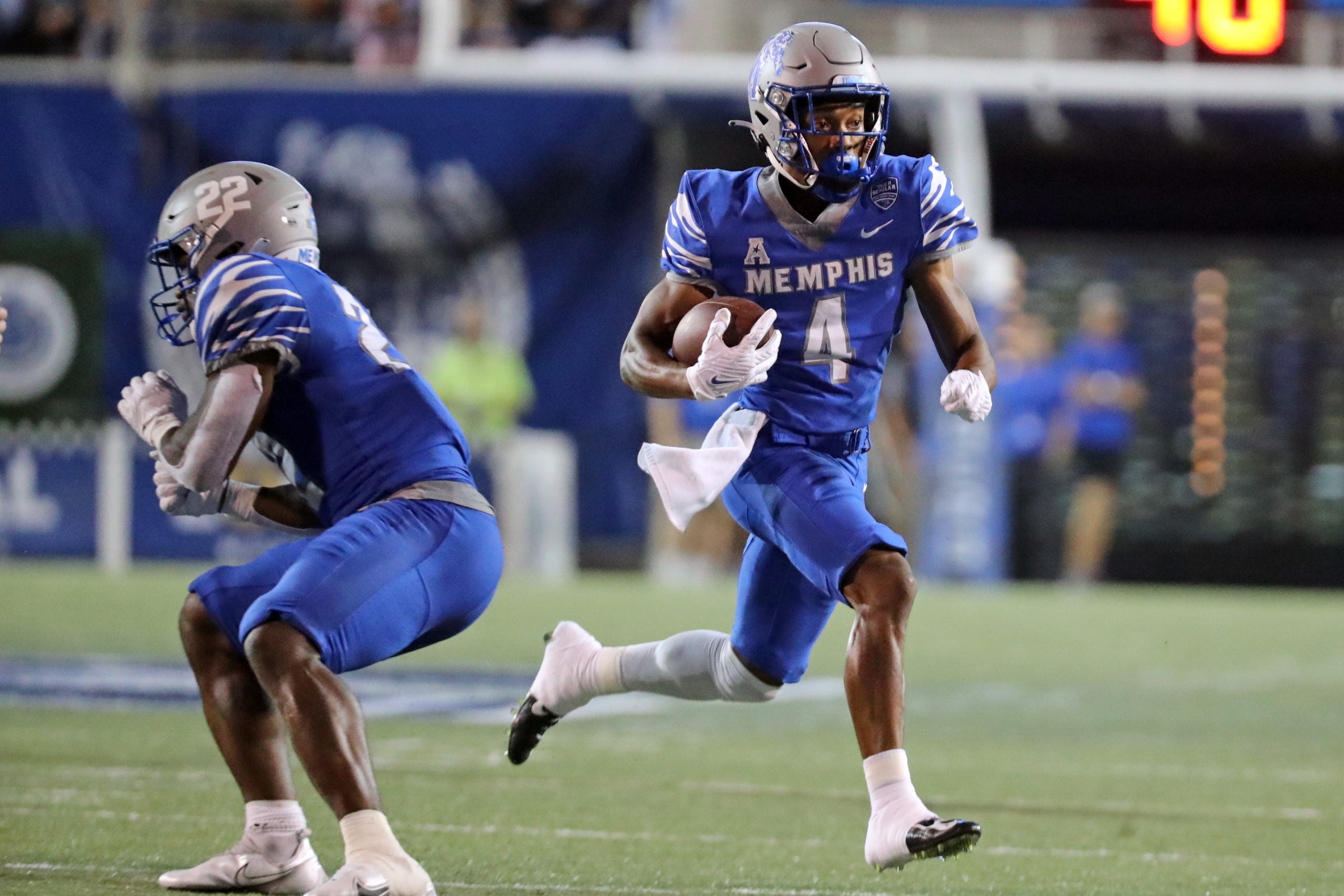 Oct 14, 2021; Memphis, Tennessee, USA; Memphis Tigers wide receiver Calvin Austin III (4) runs after a catch for a first down during the first half against the Navy Midshipmen at Liberty Bowl Memorial Stadium. Mandatory Credit: Petre Thomas-USA TODAY Sports
