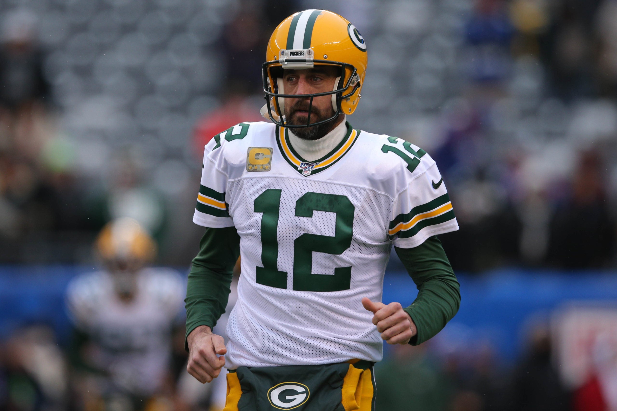 Dec 1, 2019; East Rutherford, NJ, USA; Green Bay Packers quarterback Aaron Rodgers (12) runs onto the field before a game against the New York Giants at MetLife Stadium. Mandatory Credit: Brad Penner-USA TODAY Sports