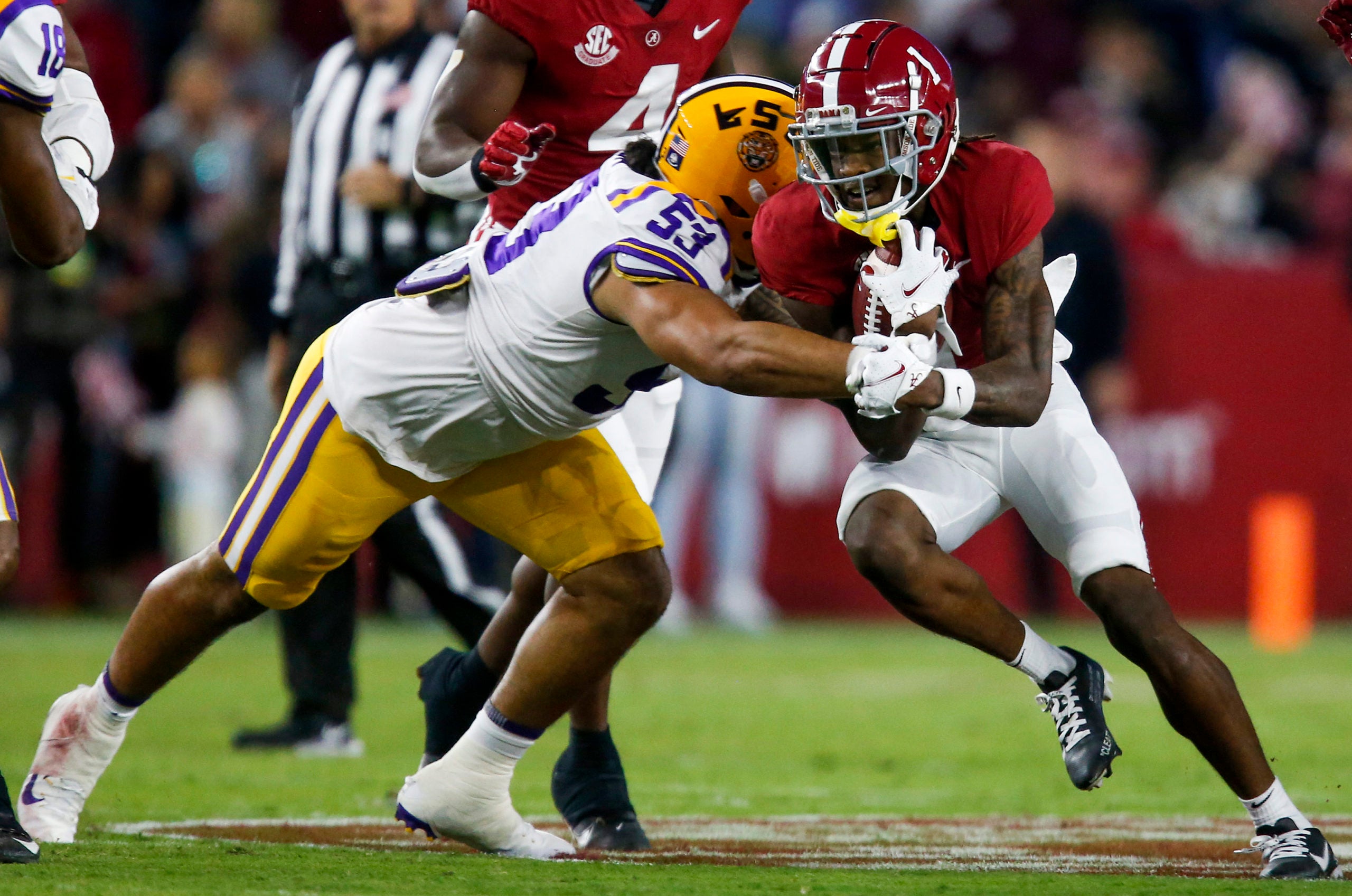 Nov 6, 2021; Tuscaloosa, Alabama, USA;  Alabama Crimson Tide wide receiver Jameson Williams (1) runs the ball against LSU Tigers defensive end Soni Fonua (53) at Bryant-Denny Stadium. Mandatory Credit: Gary Cosby Jr.-USA TODAY Sports