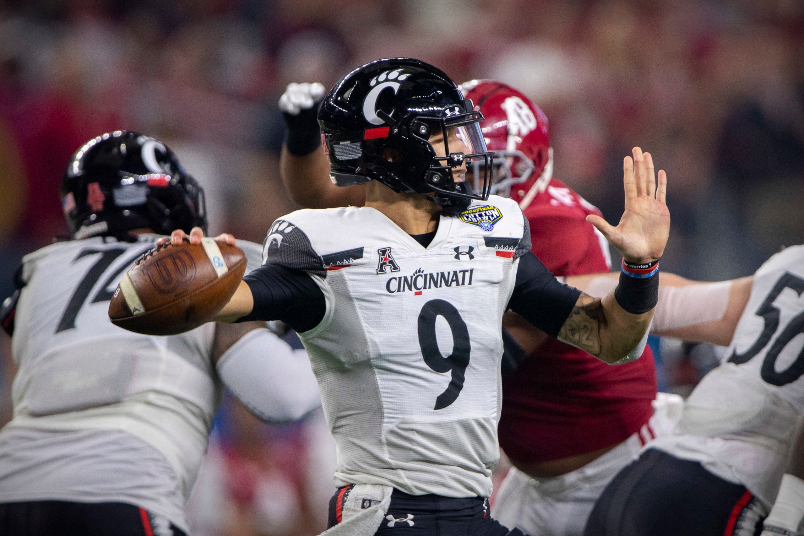 Dec 31, 2021; Arlington, Texas, USA; Cincinnati Bearcats quarterback Desmond Ridder (9) passes against the Alabama Crimson Tide during the second quarter during the 2021 Cotton Bowl college football CFP national semifinal game at AT&T Stadium. Mandatory Credit: Jerome Miron-USA TODAY Sports
