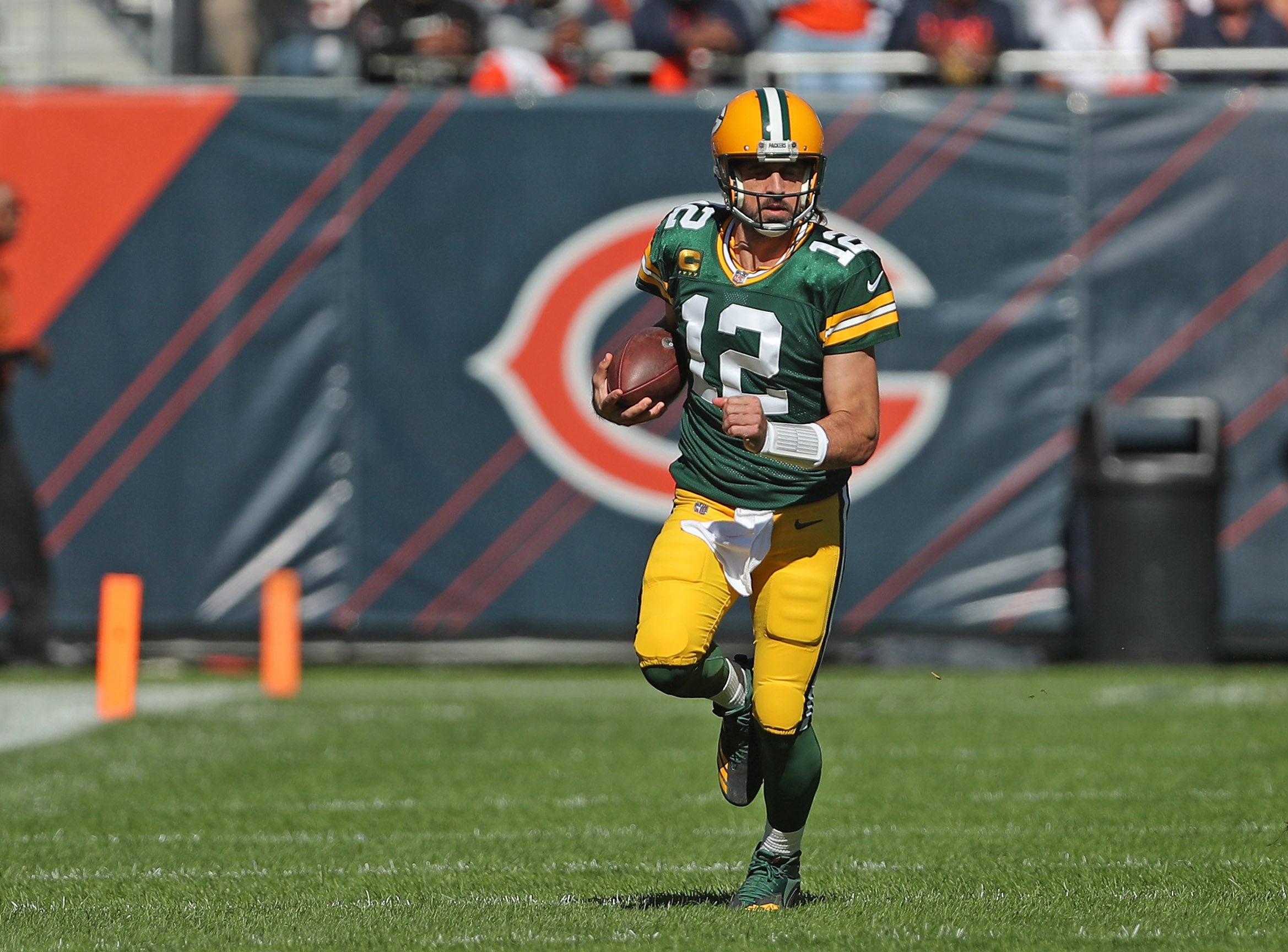 Oct 17, 2021; Chicago, Illinois, USA; Green Bay Packers quarterback Aaron Rodgers (12) runs with the ball during the first half against the Chicago Bears at Soldier Field. Mandatory Credit: Dennis Wierzbicki-USA TODAY Sports