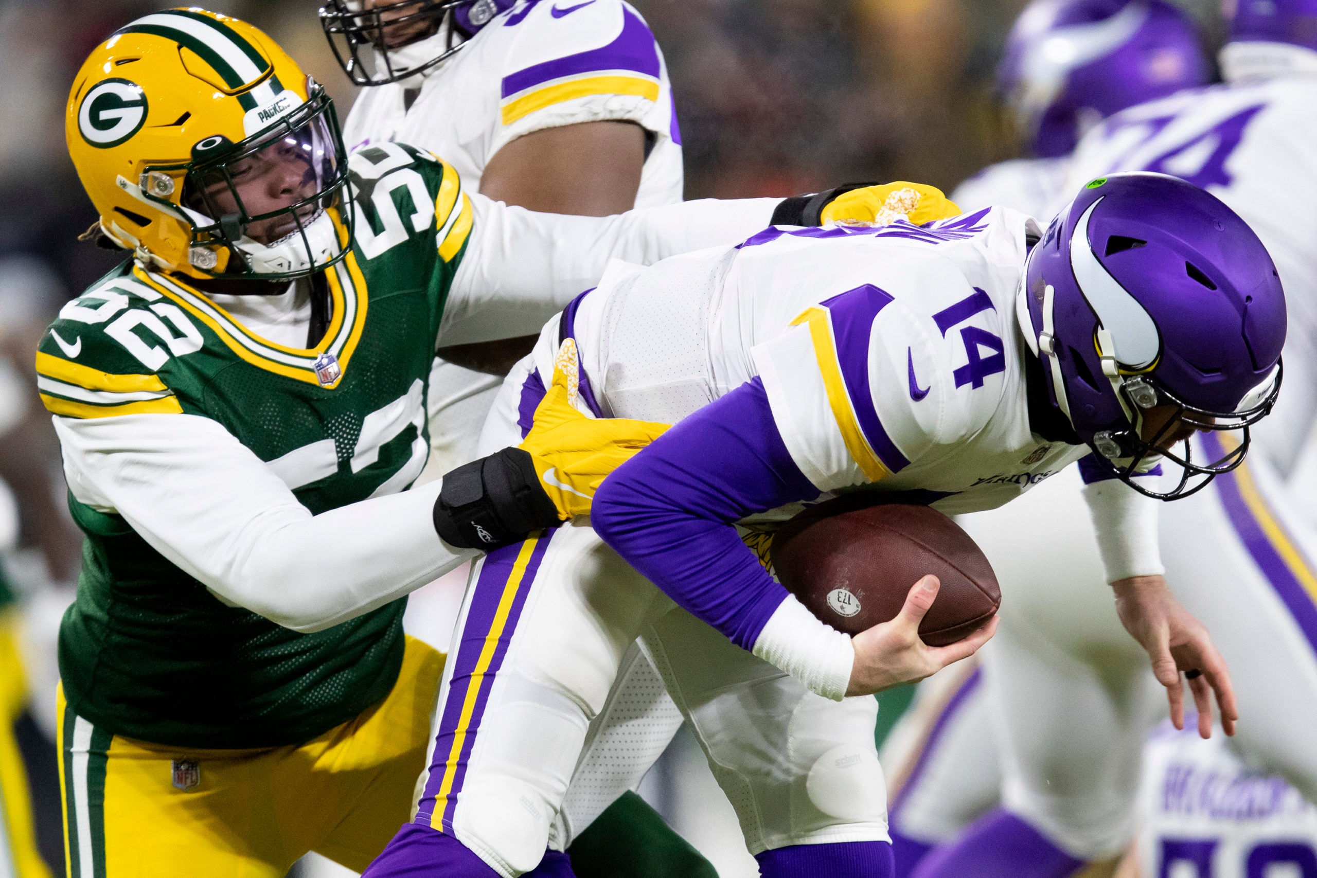 Jan 2, 2022; Green Bay, WI, USA; Green Bay Packers linebacker Rashan Gary (52) sacks Minnesota Vikings quarterback Sean Mannion (14) in the second quarter at Lambeau Field. Mandatory Credit: Samantha Madar/Green Bay Press Gazette -USA TODAY NETWORK
