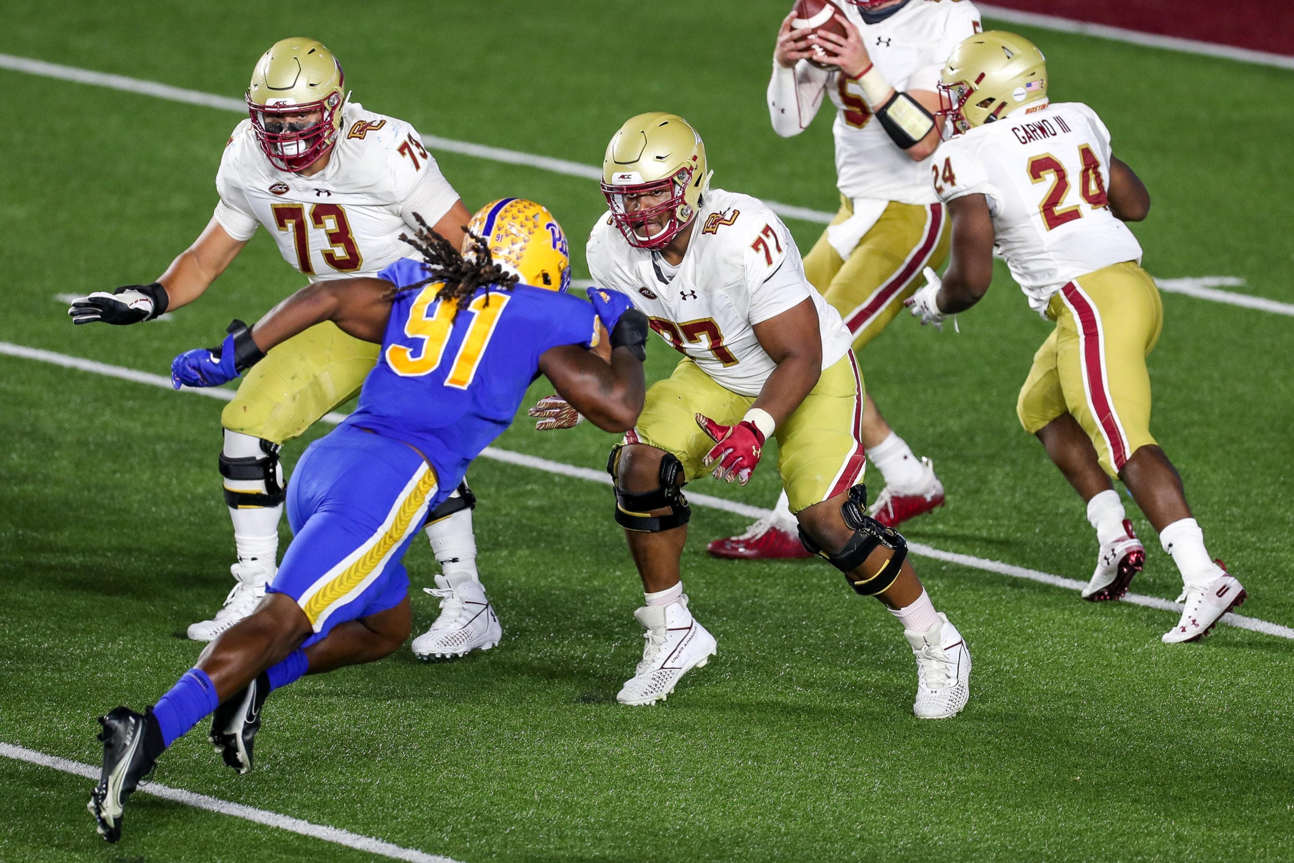 Oct 10, 2020; Chestnut Hill, Massachusetts, USA; Boston College Eagles offensive lineman Zion Johnson (77) blacks Pittsburgh Panthers defensive lineman Patrick Jones II (91) during the second half at Alumni Stadium. Mandatory Credit: Paul Rutherford-USA TODAY Sports