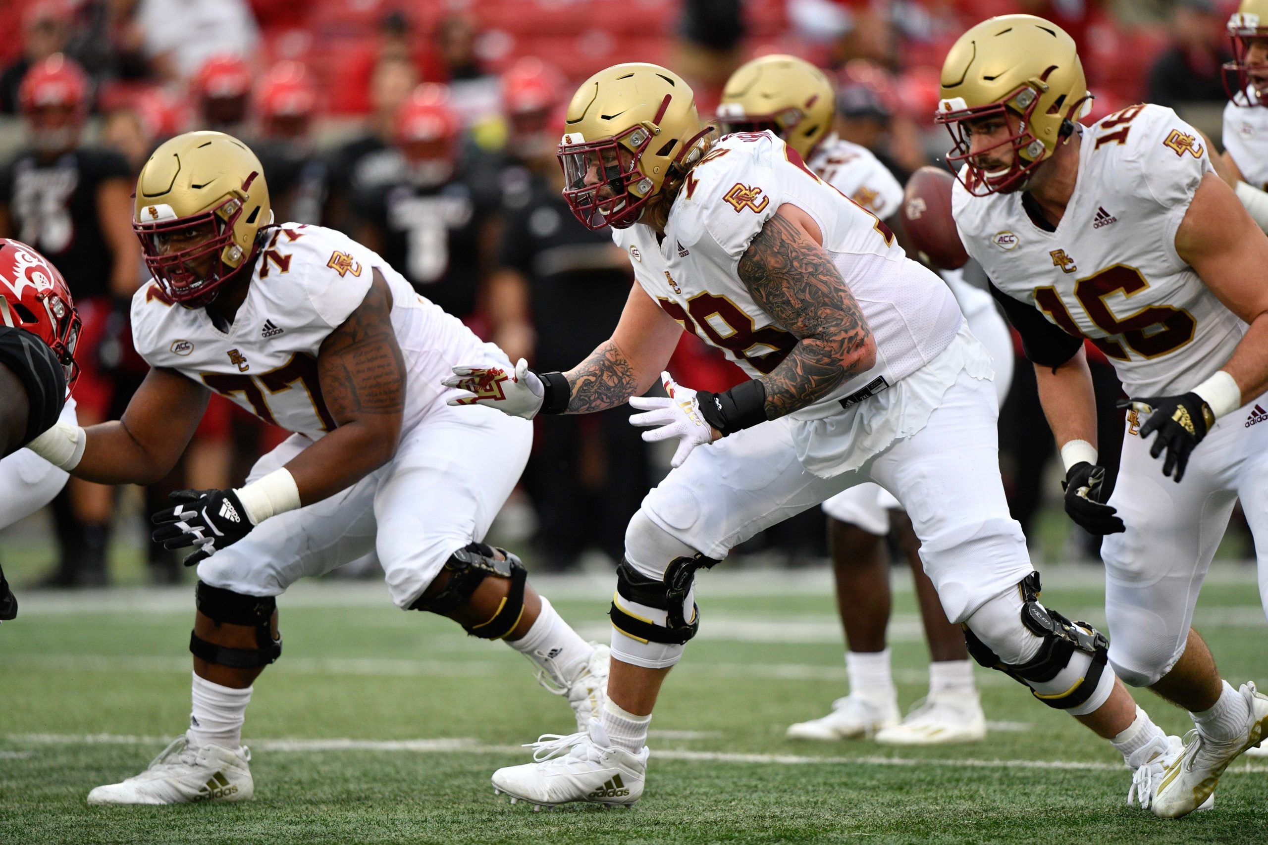 Oct 23, 2021; Louisville, Kentucky, USA;  Boston College Eagles offensive lineman Zion Johnson (77) and Boston offensive lineman Tyler Vrabel (78) prepare to block the defensive line during the first quarter of play at Cardinal Stadium. Louisville defeated Boston College 28-14. Mandatory Credit: Jamie Rhodes-USA TODAY Sports