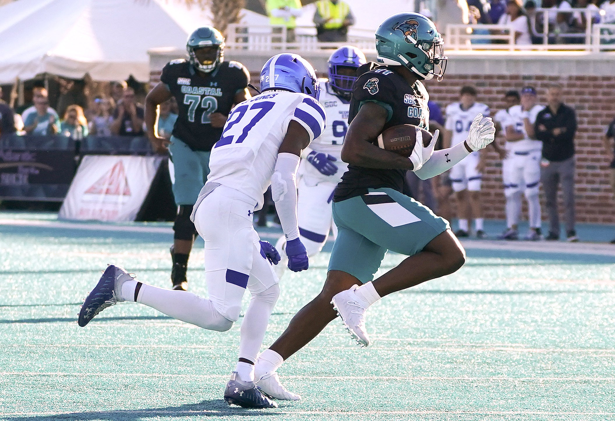 Nov 13, 2021; Conway, South Carolina, USA; Coastal Carolina Chanticleers wide receiver Kameron Brown (11) outruns Georgia State Panthers cornerback Jaylon Jones (27) at Brooks Stadium. Mandatory Credit: David Yeazell-USA TODAY Sports