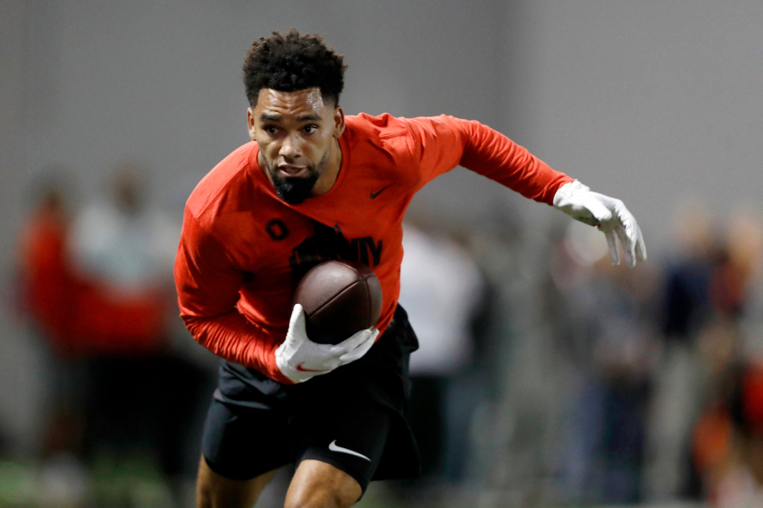 Mar 23, 2022; Columbus, Ohio, USA; Ohio State Buckeyes wide receiver Chris Olave runs after making the catch during the Ohio State Pro Day at the Woody Hayes Facility. Mandatory Credit: Joseph Maiorana-USA TODAY Sports