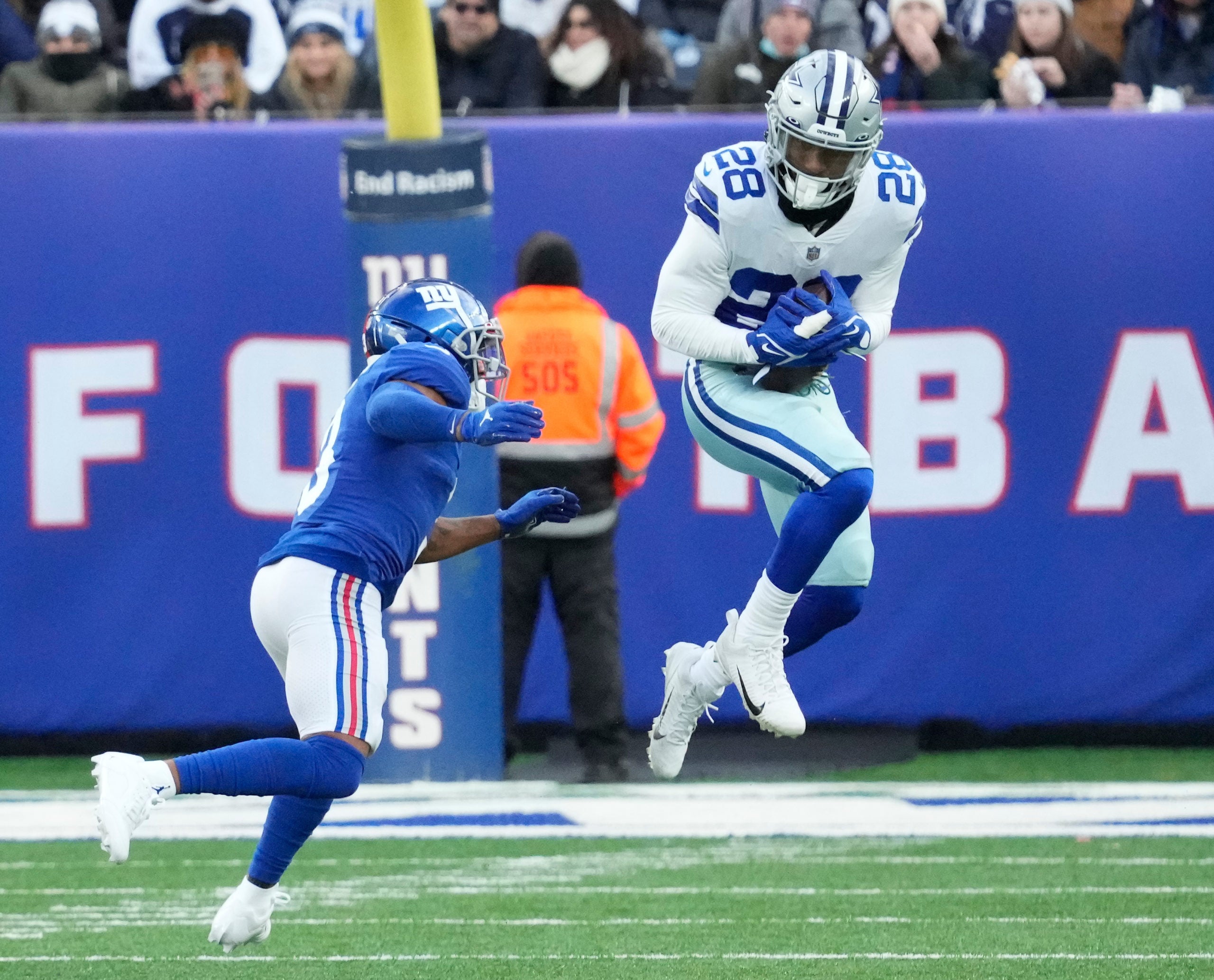 Dec 19, 2021; East Rutherford, N.J., USA; Dallas Cowboys safety Malik Hooker (28) intercepts a pass against the New York Giants in the second half at MetLife Stadium. Mandatory Credit: Robert Deutsch-USA TODAY Sports