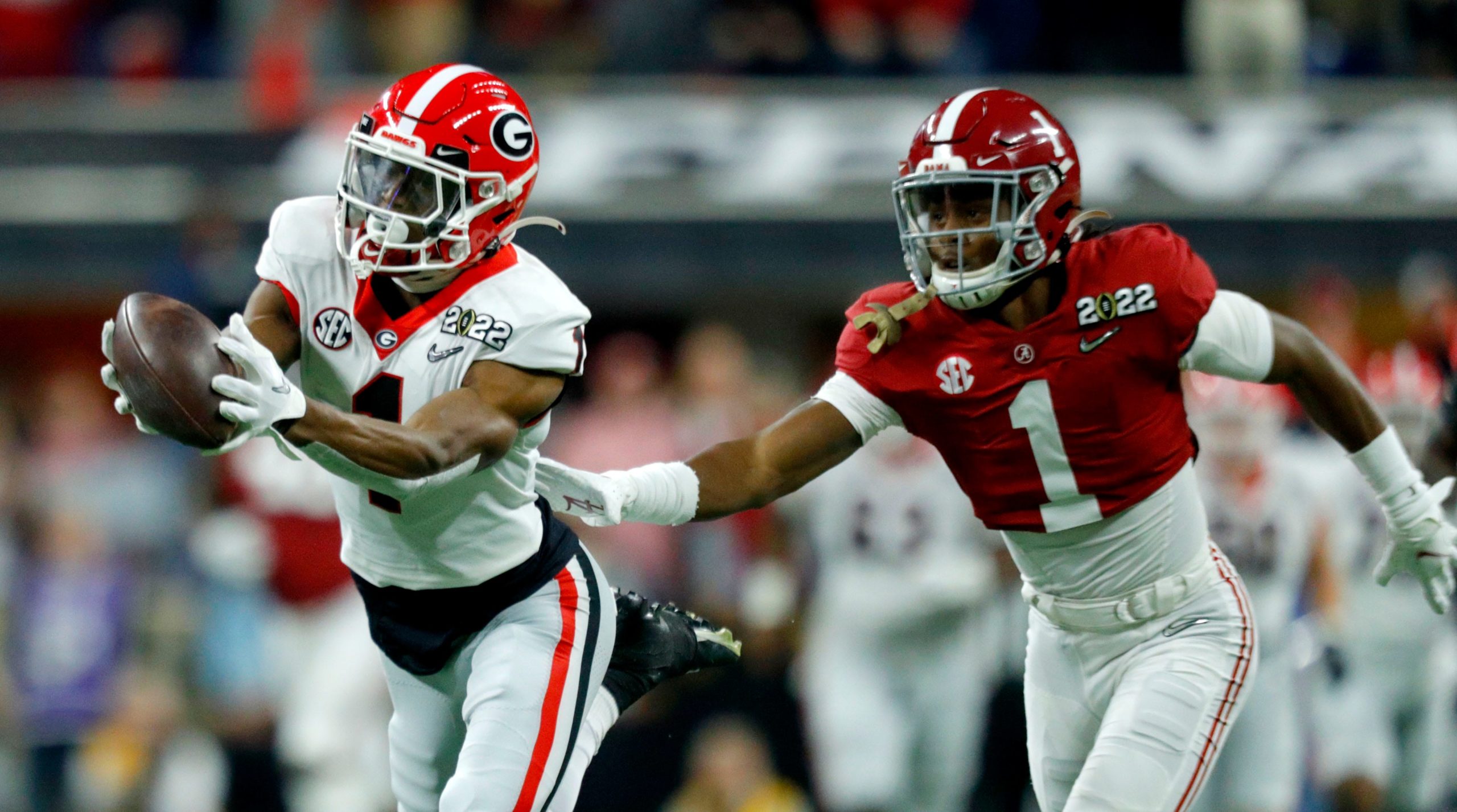 Georgia Bulldogs wide receiver George Pickens (1) makes a diving catch while being guarded by Alabama Crimson Tide defensive back Kool-Aid McKinstry (1) on Monday, Jan. 10, 2022, during the College Football Playoff National Championship at Lucas Oil Stadium in Indianapolis.