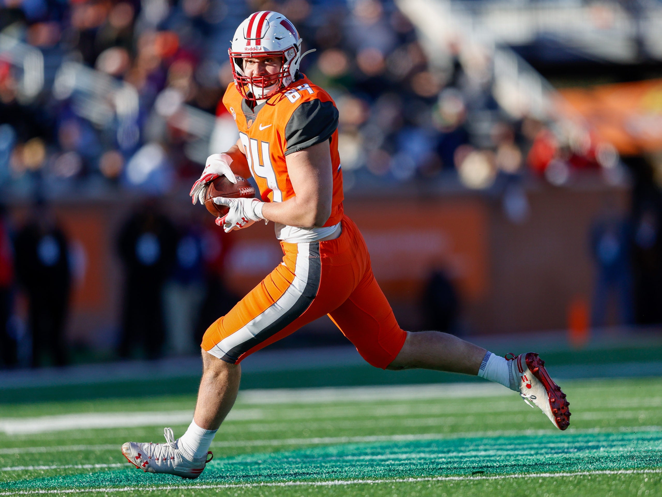 Feb 5, 2022; Mobile, AL, USA;  National squad tight end Jake Ferguson of Wisconsin (84) runs with the ball in the second half against the American squad at Hancock Whitney Stadium. Mandatory Credit: Nathan Ray Seebeck-USA TODAY Sports