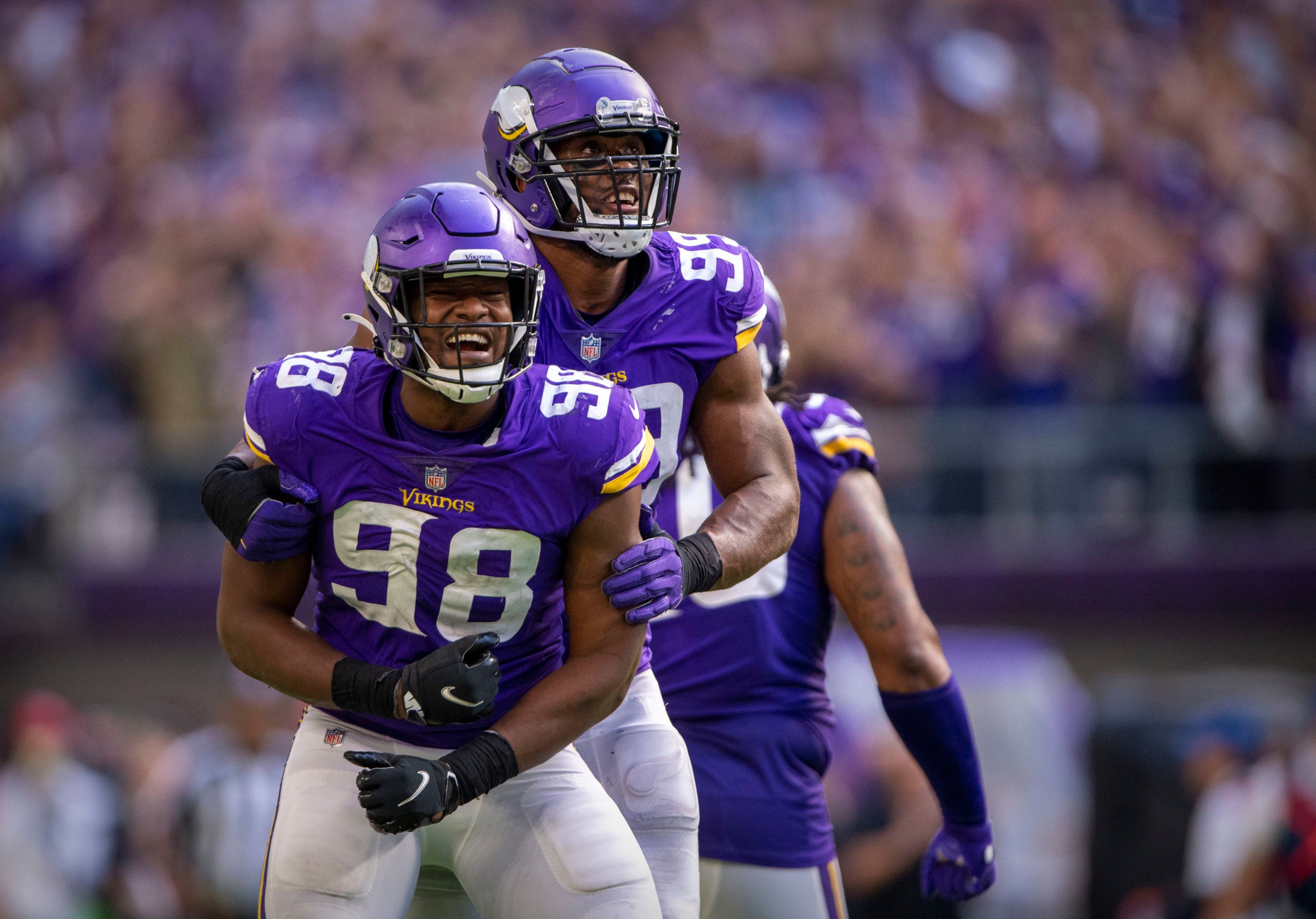 Oct 10, 2021; Minneapolis, Minnesota, USA; Minnesota Vikings defensive end D.J. Wonnum (98) and defensive end Danielle Hunter (99) celebrates a sack of Detroit Lions quarterback Jared Goff (not pictured) during the fourth quarter at U.S. Bank Stadium. Mandatory Credit: Jerome Miron-USA TODAY Sports