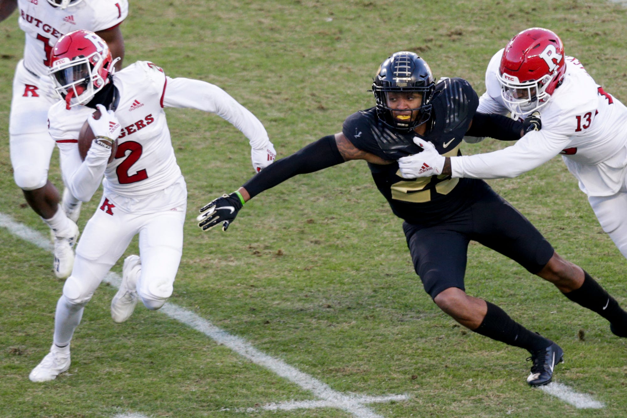 Purdue linebacker Tyler Coyle (25) reaches out for Rutgers wide receiver Aron Cruickshank (2)during the first quarter of an NCAA college football game, Saturday, Nov. 28, 2020 at Ross-Ade Stadium in West Lafayette. Cfb Purdue Vs Rutgers