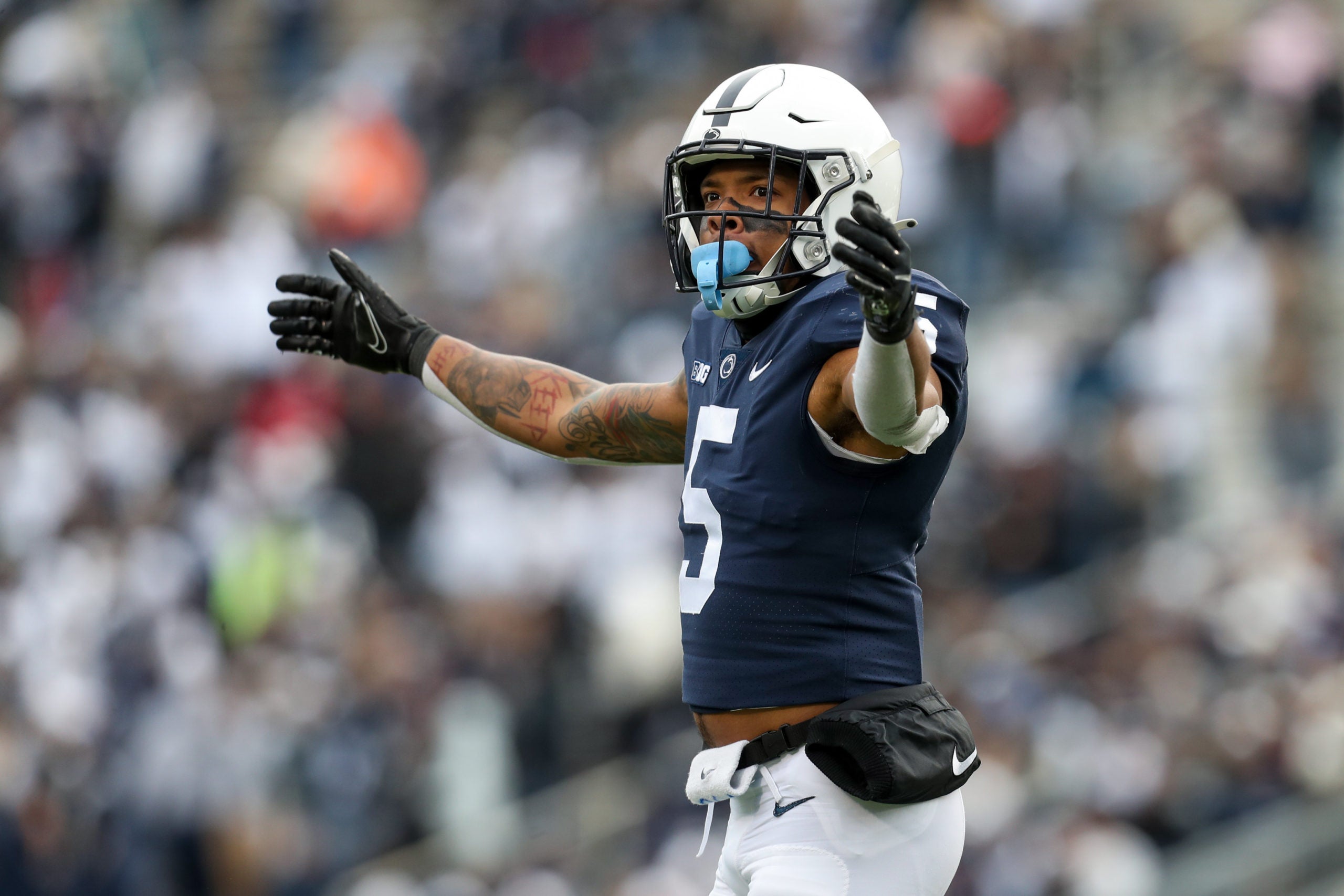 Nov 20, 2021; University Park, Pennsylvania, USA; Penn State Nittany Lions cornerback Tariq Castro-Fields (5) interacts with the crowd during the third quarter against the Rutgers Scarlet Knights at Beaver Stadium. Penn State defeated Rutgers 28-0. Mandatory Credit: Matthew OHaren-USA TODAY Sports