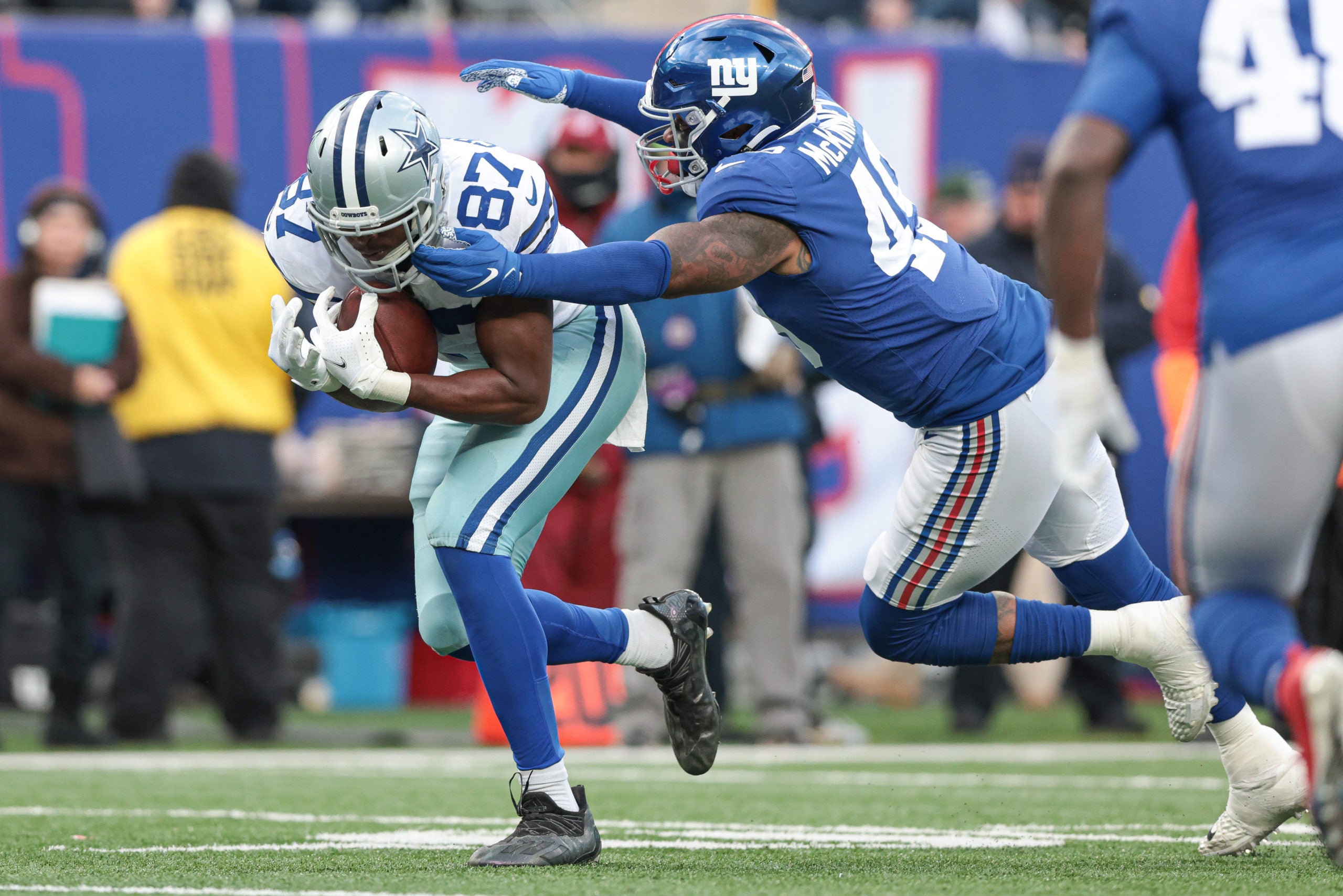 Dec 19, 2021; East Rutherford, New Jersey, USA;  Dallas Cowboys tight end Jeremy Sprinkle (87) is tackled by New York Giants inside linebacker Benardrick McKinney (49) during the second half at MetLife Stadium. Mandatory Credit: Vincent Carchietta-USA TODAY Sports