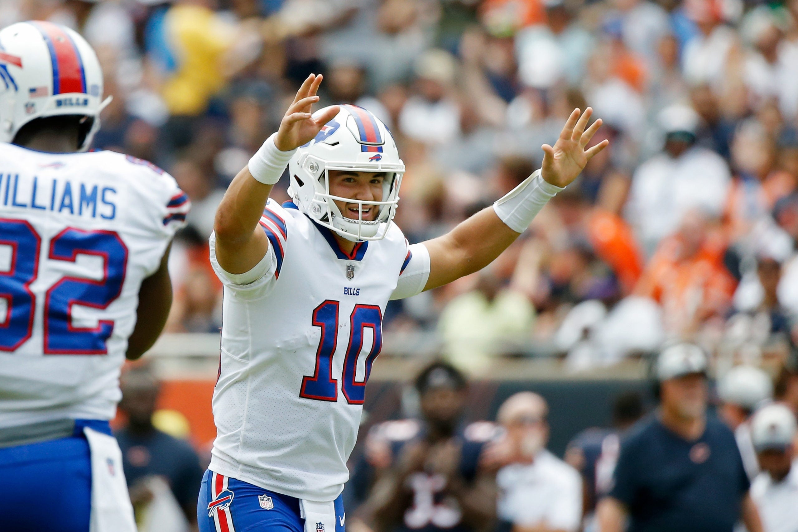 Aug 21, 2021; Chicago, Illinois, USA; Buffalo Bills quarterback Mitchell Trubisky (10) smiles after a touchdown against the Chicago Bears during the first half at Soldier Field. Mandatory Credit: Jon Durr-USA TODAY Sports