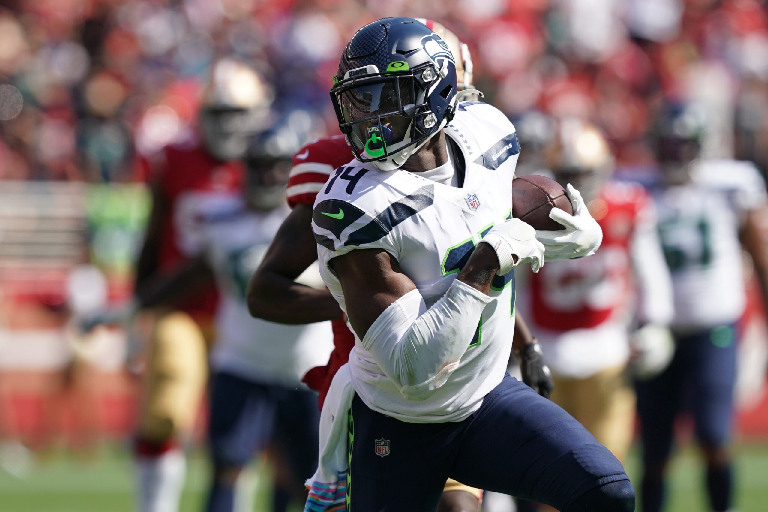 Oct 3, 2021; Santa Clara, California, USA; Seattle Seahawks wide receiver DK Metcalf (14) runs after a catch during the second quarter against the San Francisco 49ers at Levi's Stadium. Mandatory Credit: Darren Yamashita-USA TODAY Sports