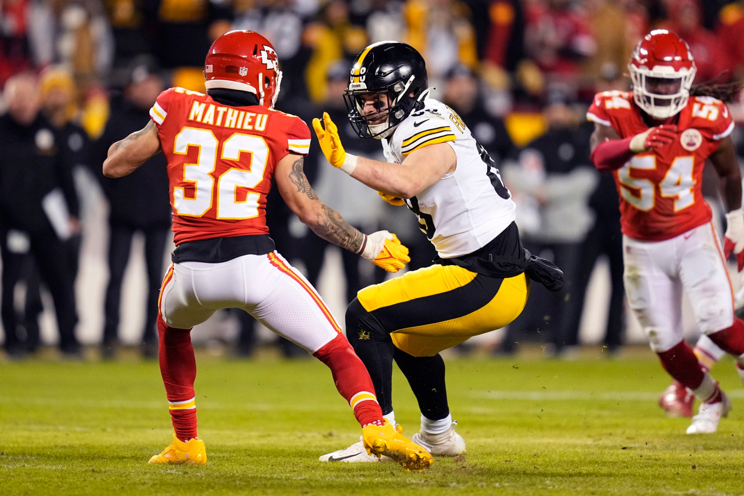 Jan 16, 2022; Kansas City, Missouri, USA; Pittsburgh Steelers tight end Pat Freiermuth (88) is tackled by Kansas City Chiefs free safety Tyrann Mathieu (32) during the second half in an AFC Wild Card playoff football game at GEHA Field at Arrowhead Stadium. Mandatory Credit: Jay Biggerstaff-USA TODAY Sports