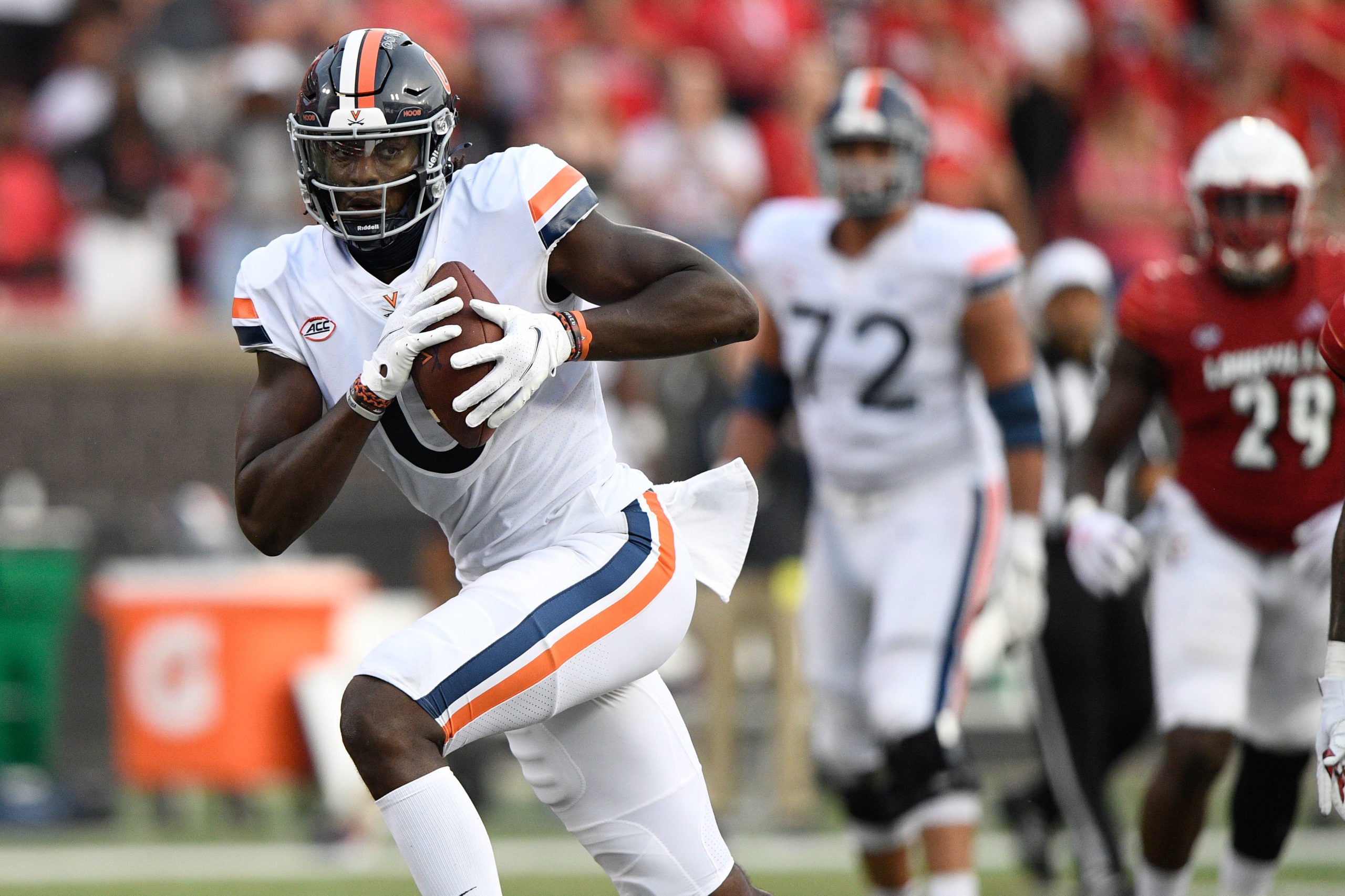 Oct 9, 2021; Louisville, Kentucky, USA;  Virginia Cavaliers tight end Jelani Woods (0) runs the ball against the Louisville Cardinals during the second half at Cardinal Stadium. Virginia defeated Louisville 34-33. Mandatory Credit: Jamie Rhodes-USA TODAY Sports