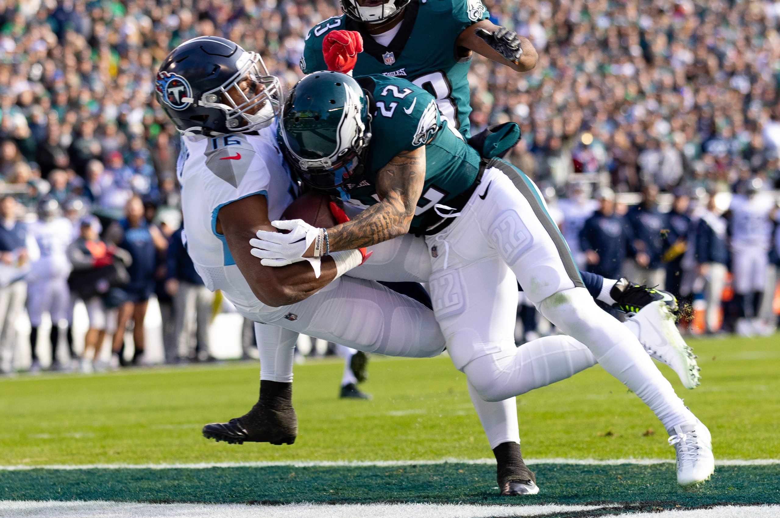 Dec 4, 2022; Philadelphia, Pennsylvania, USA;  Tennessee Titans wide receiver Treylon Burks (16) is hit by Philadelphia Eagles safety Marcus Epps (22) as he makes a touchdown catch during the first quarter at Lincoln Financial Field. Mandatory Credit: Bill Streicher-USA TODAY Sports