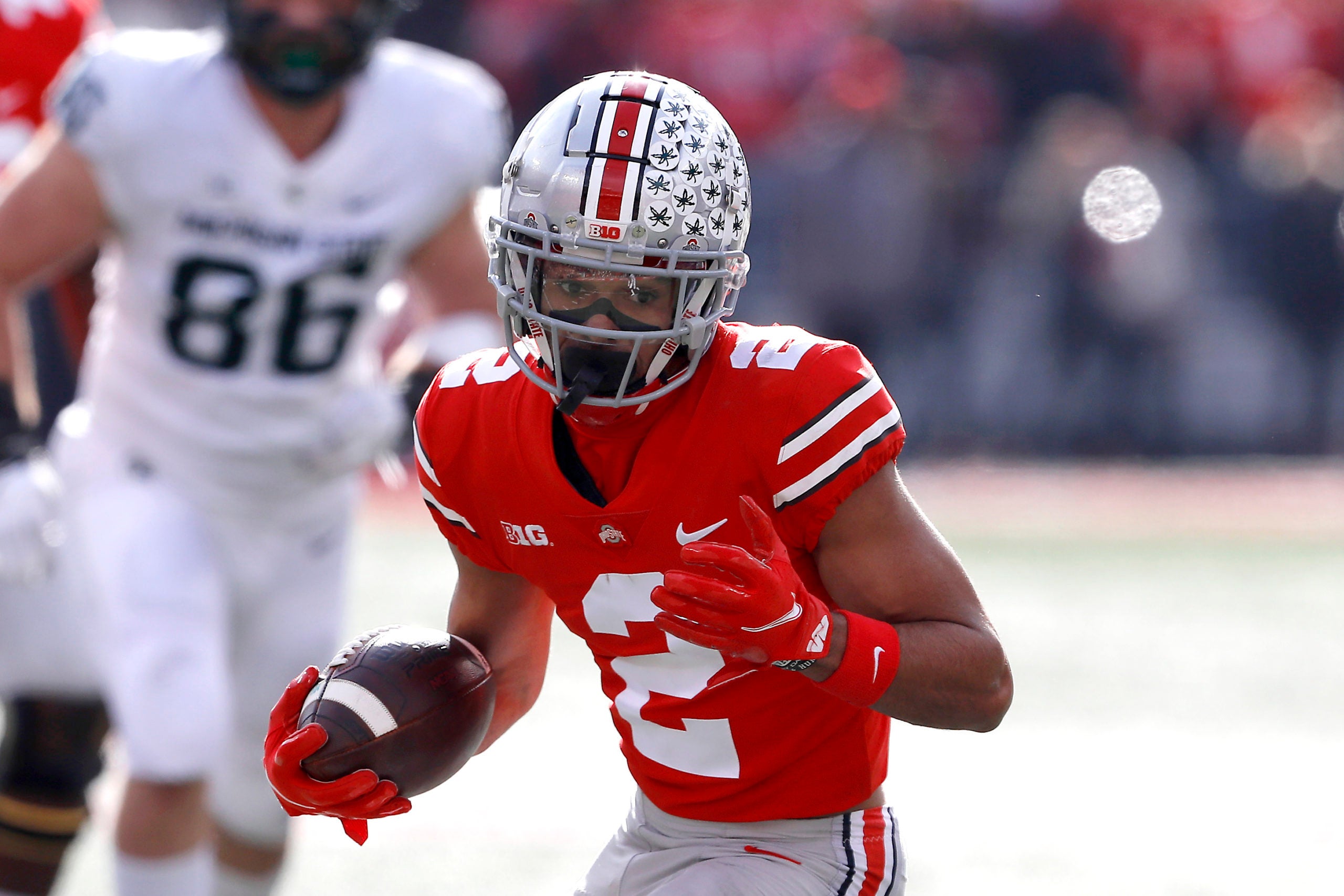 Nov 20, 2021; Columbus, Ohio, USA; Ohio State Buckeyes wide receiver Chris Olave (2) runs during the second quarter against the Michigan State Spartans at Ohio Stadium. Mandatory Credit: Joseph Maiorana-USA TODAY Sports