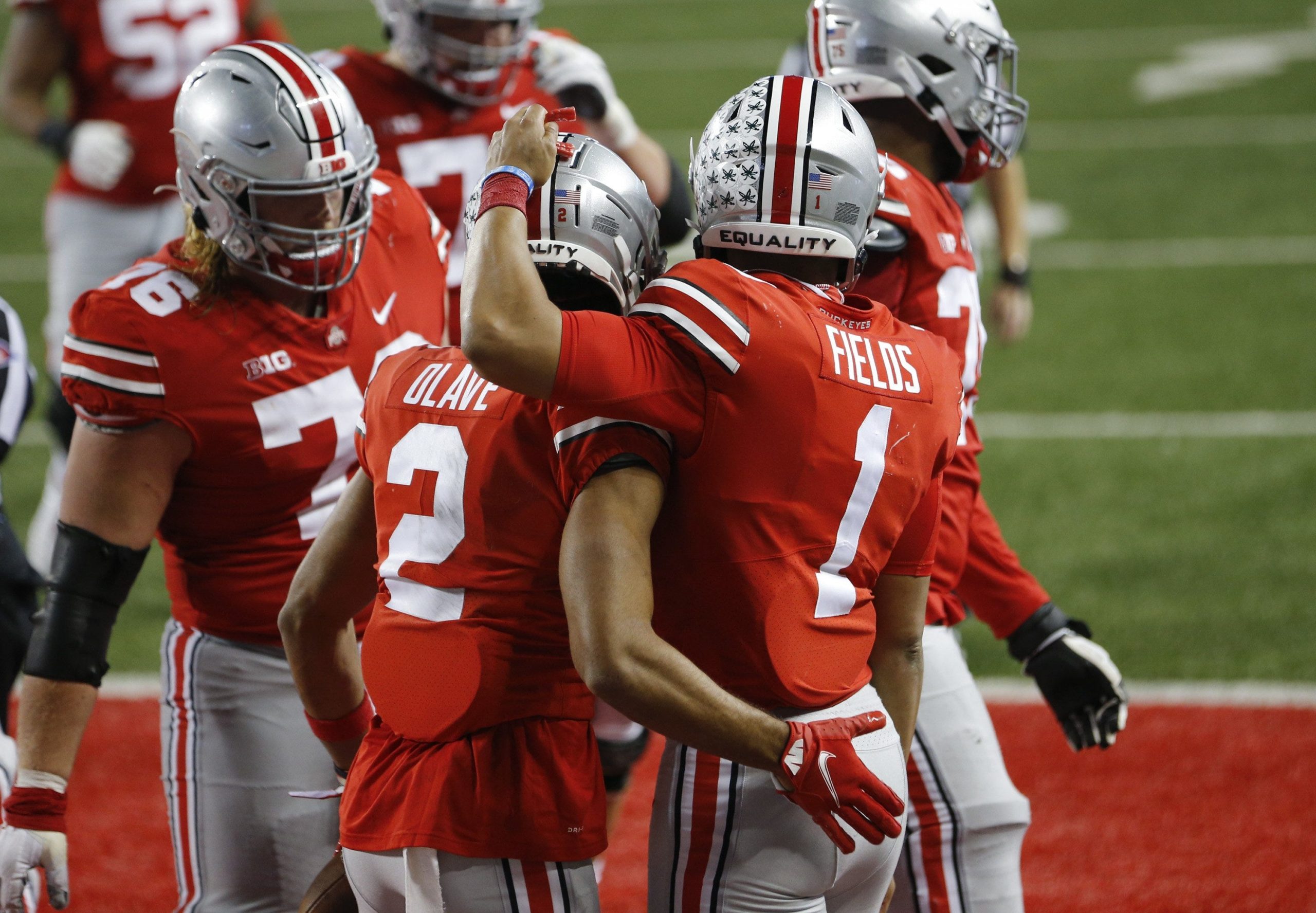 Ohio State Buckeyes wide receiver Chris Olave (2) celebrates a 33-yard touchdown catch from quarterback Justin Fields (1) during the fourth quarter of the NCAA football game against the Rutgers Scarlet Knights at Ohio Stadium in Columbus, Ohio on Saturday, Nov. 7, 2020. Ohio State won 49-27. Ohio State Buckeyes Football Faces The Rutgers Scarlet Knights