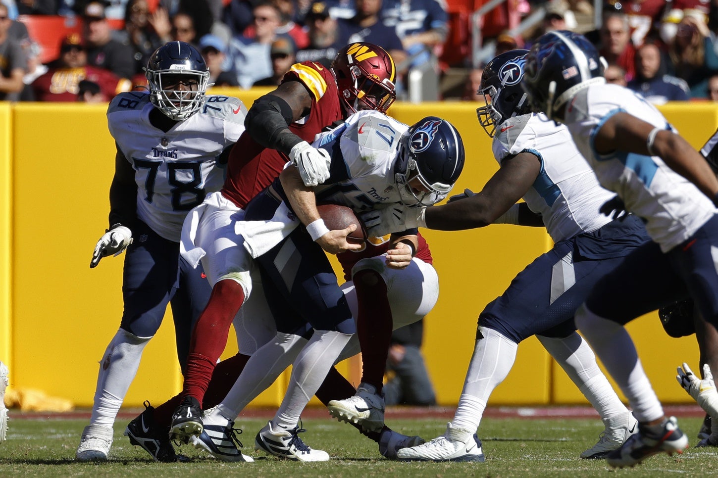 Oct 9, 2022; Landover, Maryland, USA; Tennessee Titans quarterback Ryan Tannehill (17) is sacked by Washington Commanders defensive end James Smith-Williams (96) during the third quarter at FedExField. Mandatory Credit: Geoff Burke-USA TODAY Sports