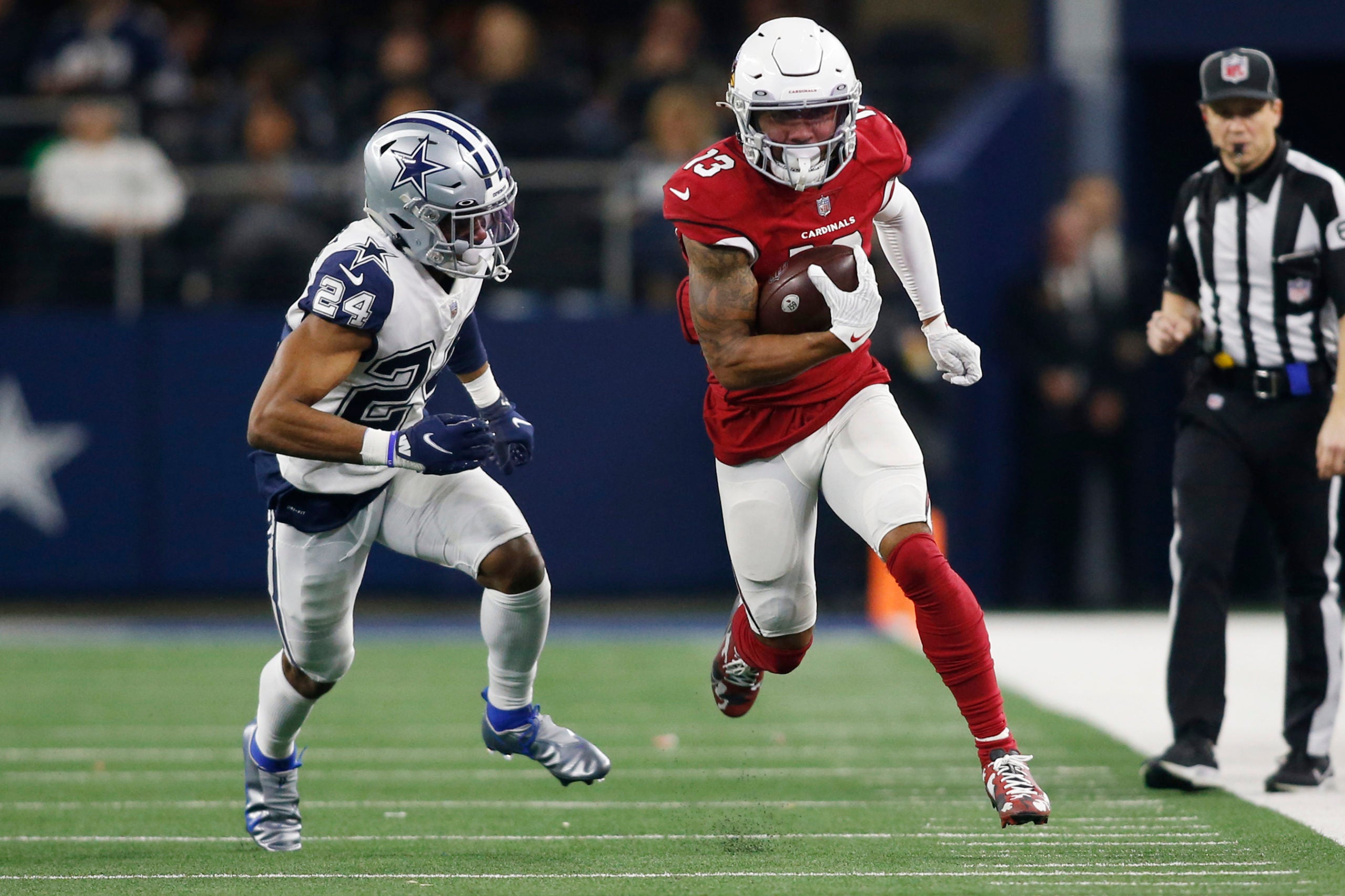Jan 2, 2022; Arlington, Texas, USA; Arizona Cardinals wide receiver Christian Kirk (13) runs with the ball after a catch against Dallas Cowboys cornerback Kelvin Joseph (24) in the third quarter at AT&T Stadium. Mandatory Credit: Tim Heitman-USA TODAY Sports