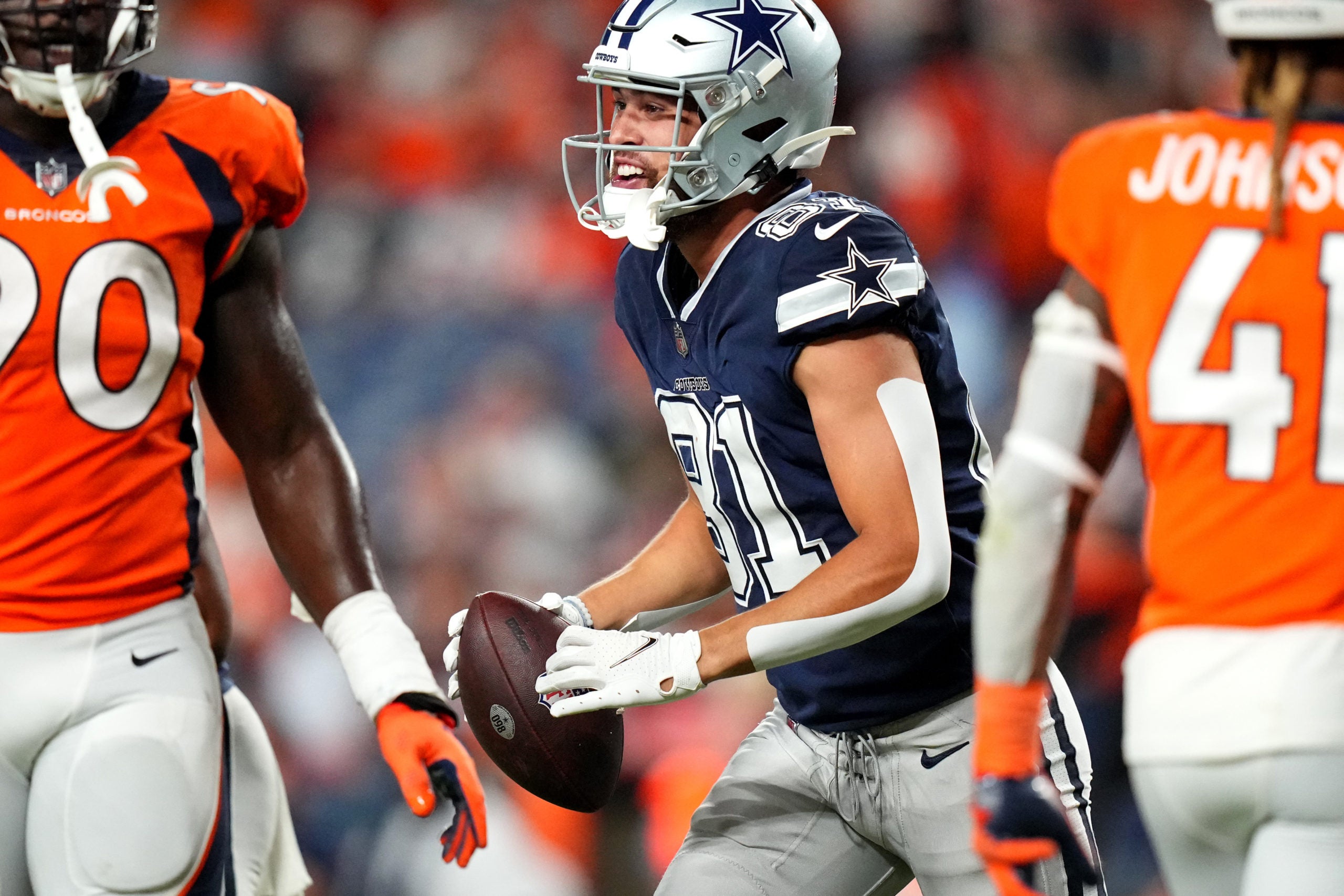 Aug 13, 2022; Denver, Colorado, USA; Dallas Cowboys wide receiver Simi Fehoko (81) celebrates his touchdown in the fourth quarter against the Denver Broncos at Empower Field at Mile High. Mandatory Credit: Ron Chenoy-USA TODAY Sports