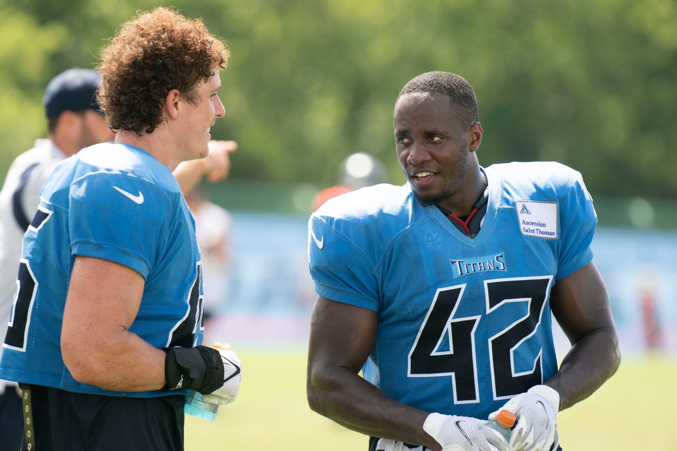 Tennessee Titans linebacker Chance Campbell (45) talks with linebacker Joe Jones (42) after a training camp practice at Ascension Saint Thomas Sports Park Monday, Aug. 8, 2022, in Nashville, Tenn. Nas 0808 Titans 023