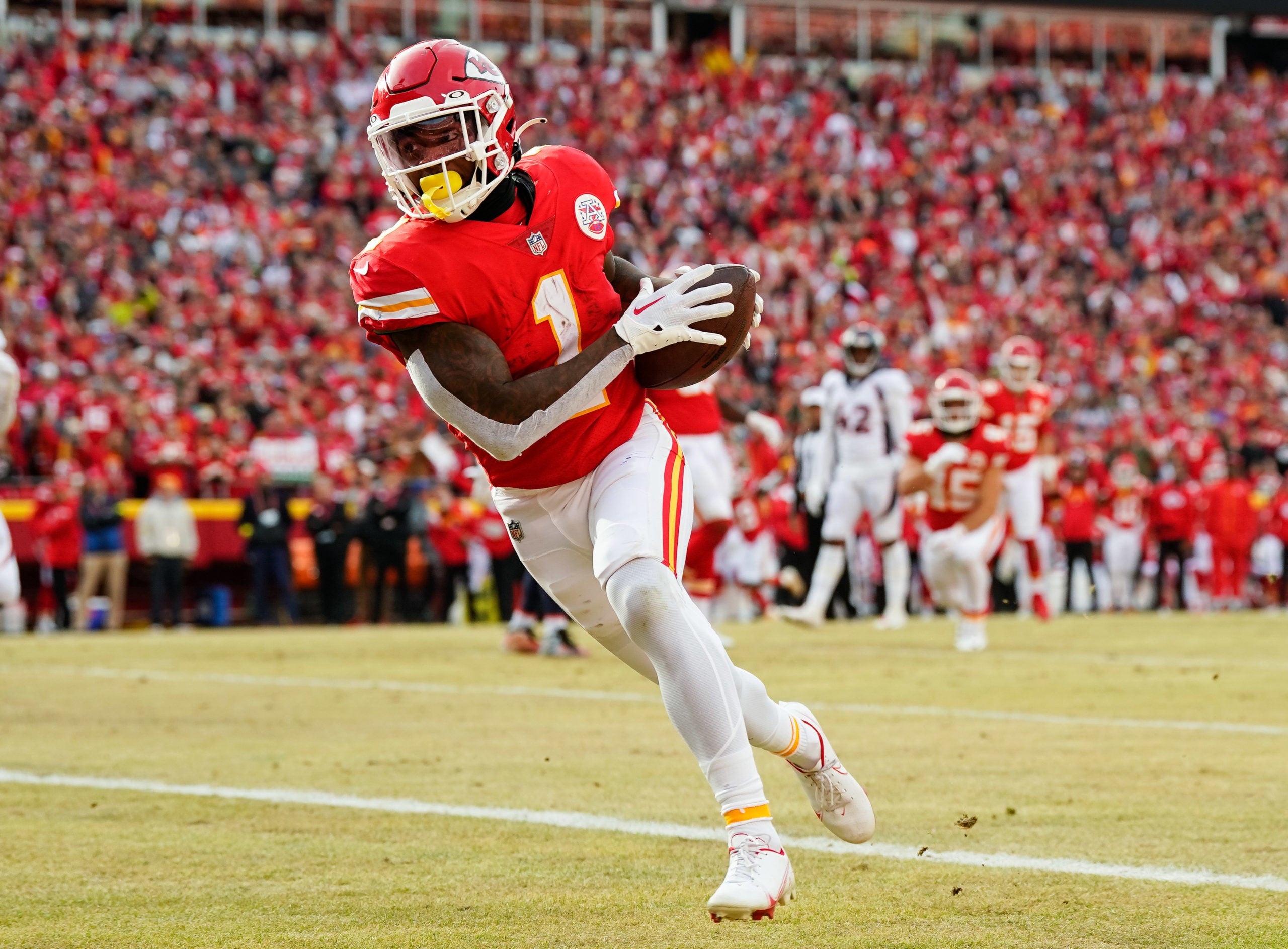 Jan 1, 2023; Kansas City, Missouri, USA; Kansas City Chiefs running back Jerick McKinnon (1) scores a touchdown during the second half against the Denver Broncos at GEHA Field at Arrowhead Stadium. Mandatory Credit: Jay Biggerstaff-USA TODAY Sports