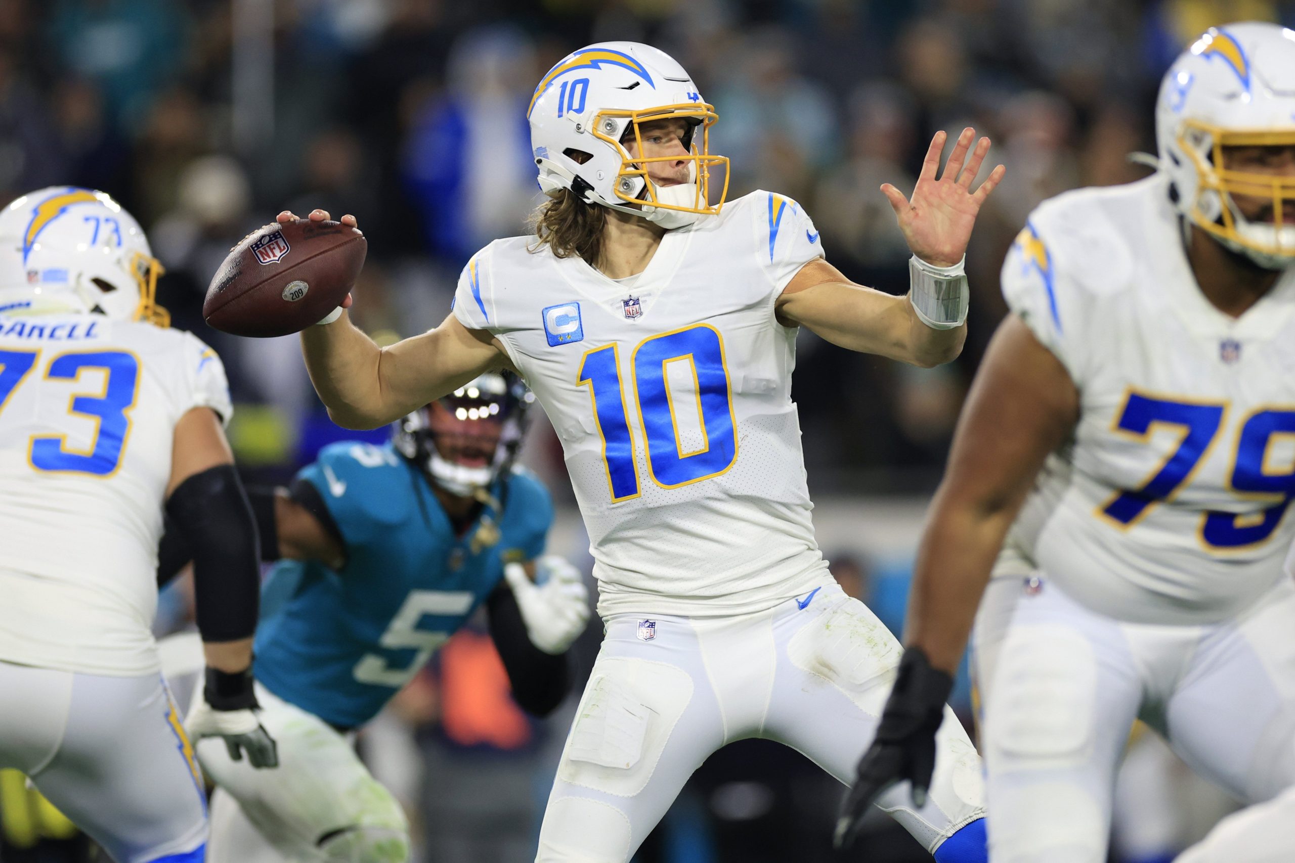 Los Angeles Chargers quarterback Justin Herbert (10) looks to pass during the third quarter of an NFL first round playoff football matchup Saturday, Jan. 14, 2023 at TIAA Bank Field in Jacksonville, Fla. Jacksonville Jaguars edged the Los Angeles Chargers on a field goal 31-30. [Corey Perrine/Florida Times-Union] Jki 011423 Chargers Jags C 46