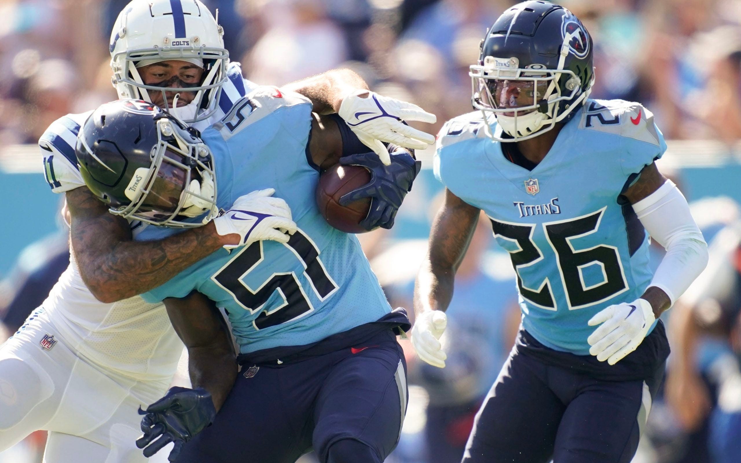 Tennessee Titans linebacker David Long Jr. (51) is tackled by Indianapolis Colts wide receiver Michael Pittman Jr. (11) after catching an interception during the second quarter at Nissan Stadium Sunday, Oct. 23, 2022, in Nashville, Tenn. Nfl Indianapolis Colts At Tennessee Titans