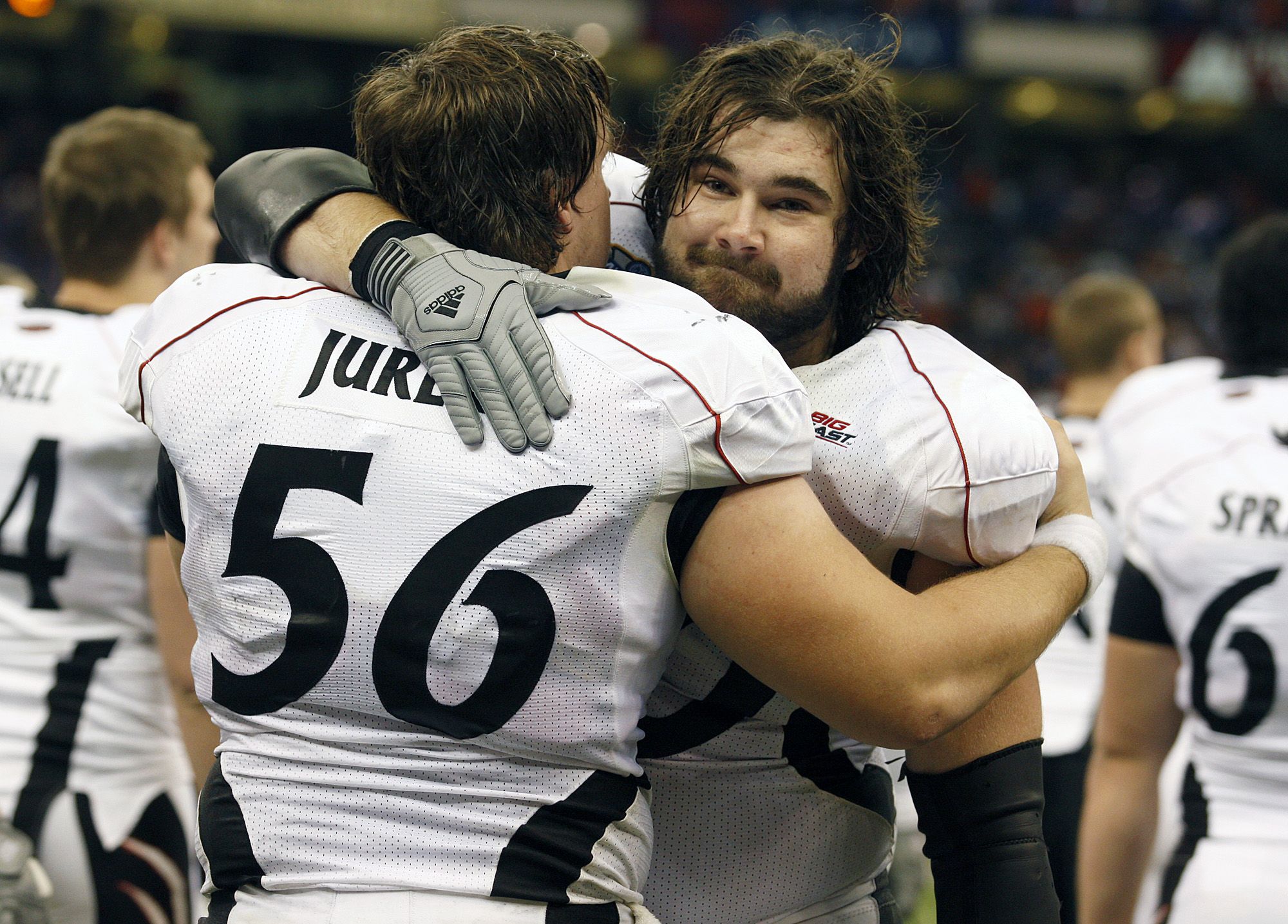 UC.FLORIDA.SPORTS.FRIDAY.JANUARY 1, 2010. University of Cincinnati's Chris Jurek, left, and Jason Kelce console one another after The Bearcats lost 51-24 to the Florida Gators in the Sugar Bowl at the Louisiana Superdome in New Orleans. Photo shot Friday January 1, 2010.  The Enquirer/Cara Owsley Sugar Secondhalf10