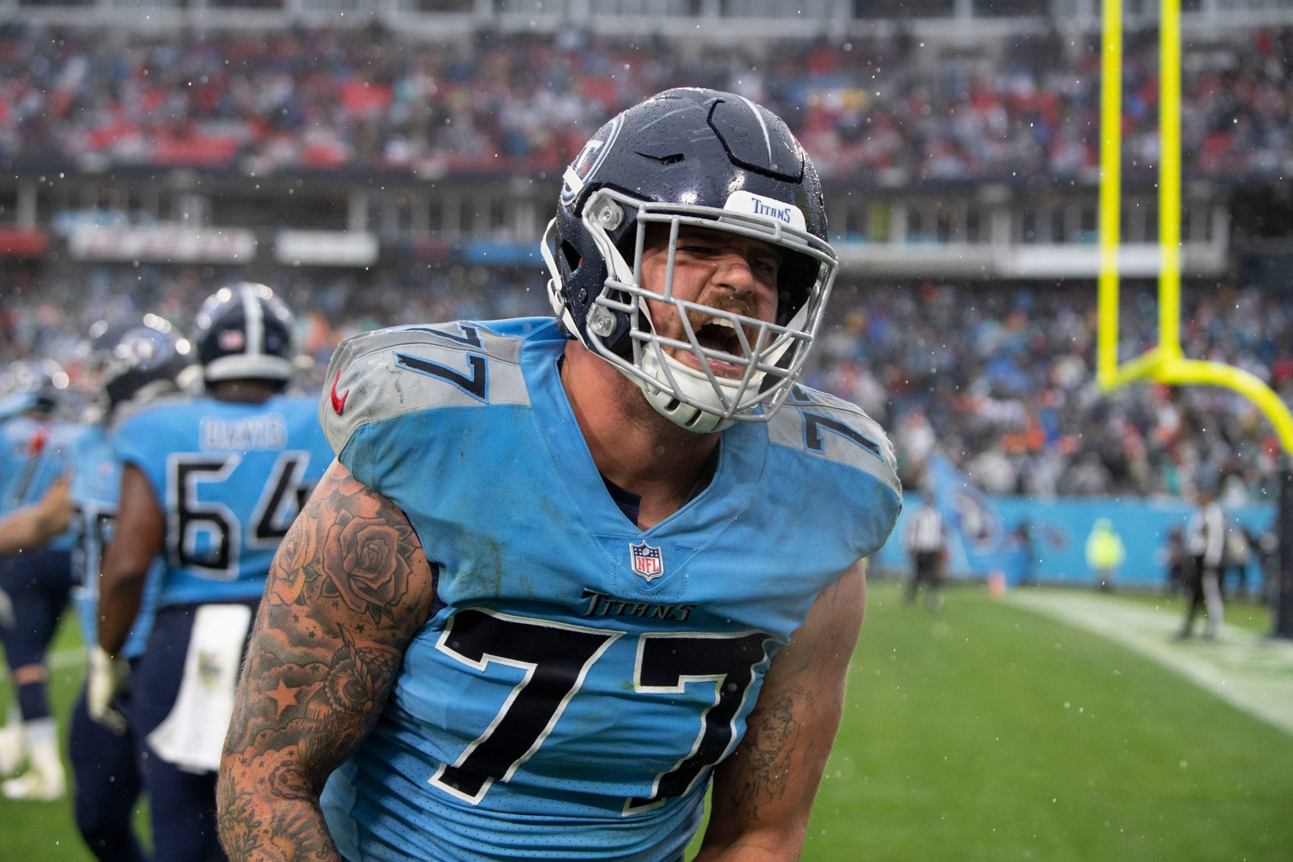 Tennessee Titans offensive tackle Taylor Lewan (77) celebrates as they defeat the Miami Dolphins 34 to 3 at Nissan Stadium Sunday, Jan. 2, 2022 in Nashville, Tenn. Nas Titans Dolphins 014