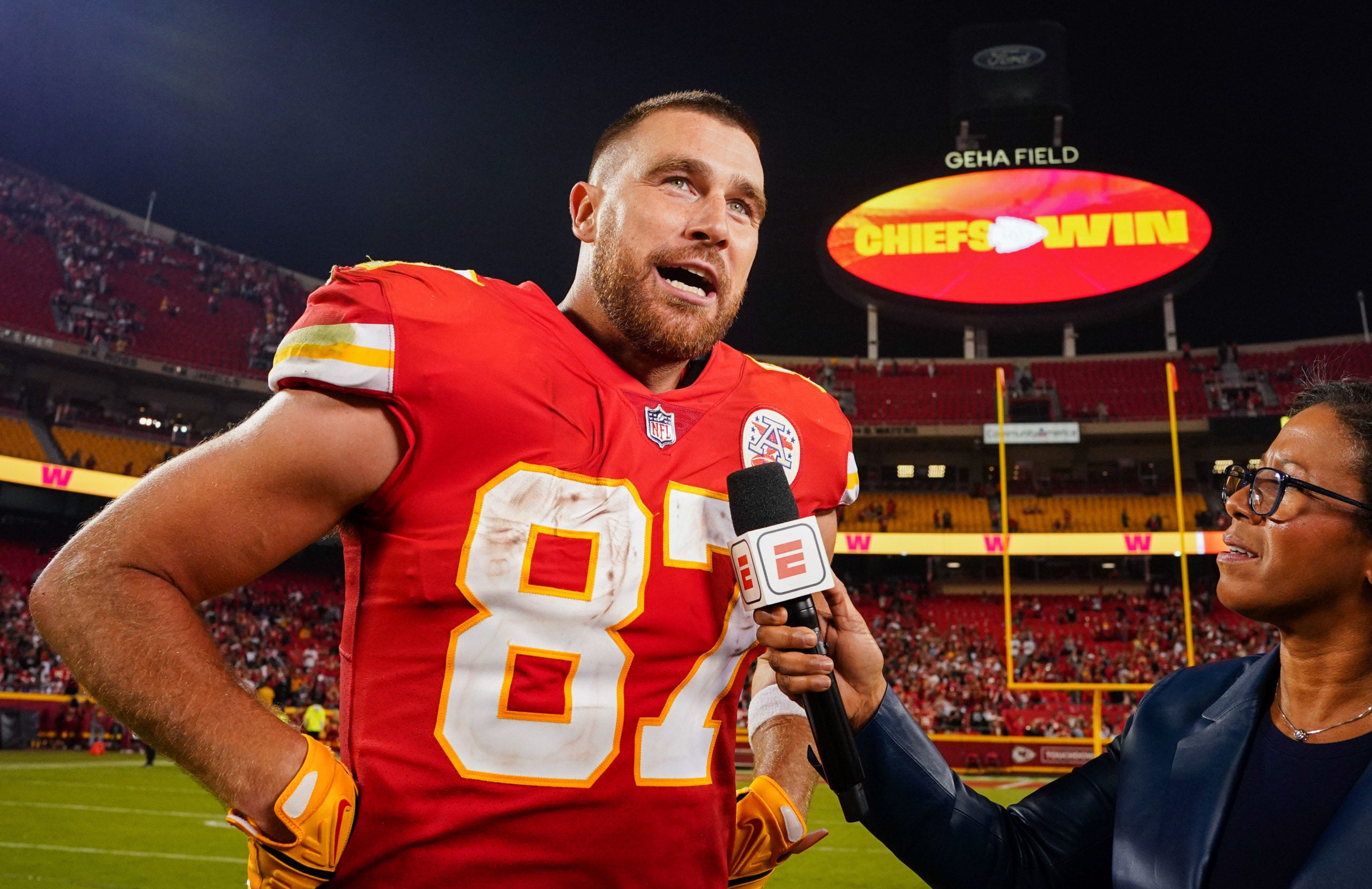 Oct 10, 2022; Kansas City, Missouri, USA; Kansas City Chiefs tight end Travis Kelce (87) talks with reporter Lisa Salters after defeating the Las Vegas Raiders at GEHA Field at Arrowhead Stadium. Mandatory Credit: Jay Biggerstaff-USA TODAY Sports