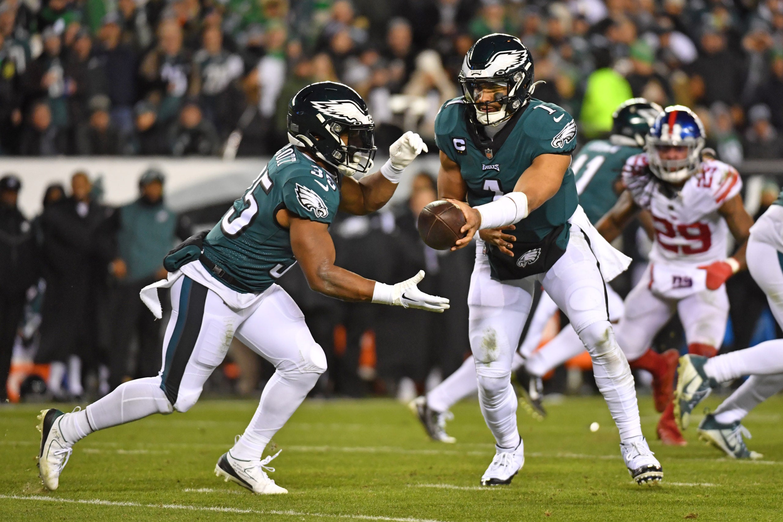 Jan 21, 2023; Philadelphia, Pennsylvania, USA; Philadelphia Eagles quarterback Jalen Hurts (1) hands off to e25 against the New York Giants during an NFC divisional round game at Lincoln Financial Field. Mandatory Credit: Eric Hartline-USA TODAY Sports