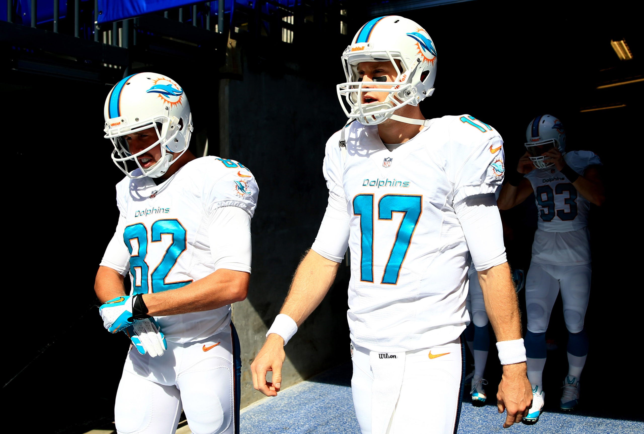 Sep 15, 2013; Indianapolis, IN, USA; Miami Dolphins quarterback Ryan Tannehill (17) and wide receiver Brian Hartline (82) walk onto the field prior to the game against the Indianapolis Colts at Lucas Oil Stadium. Mandatory Credit: Andrew Weber-USA TODAY Sports