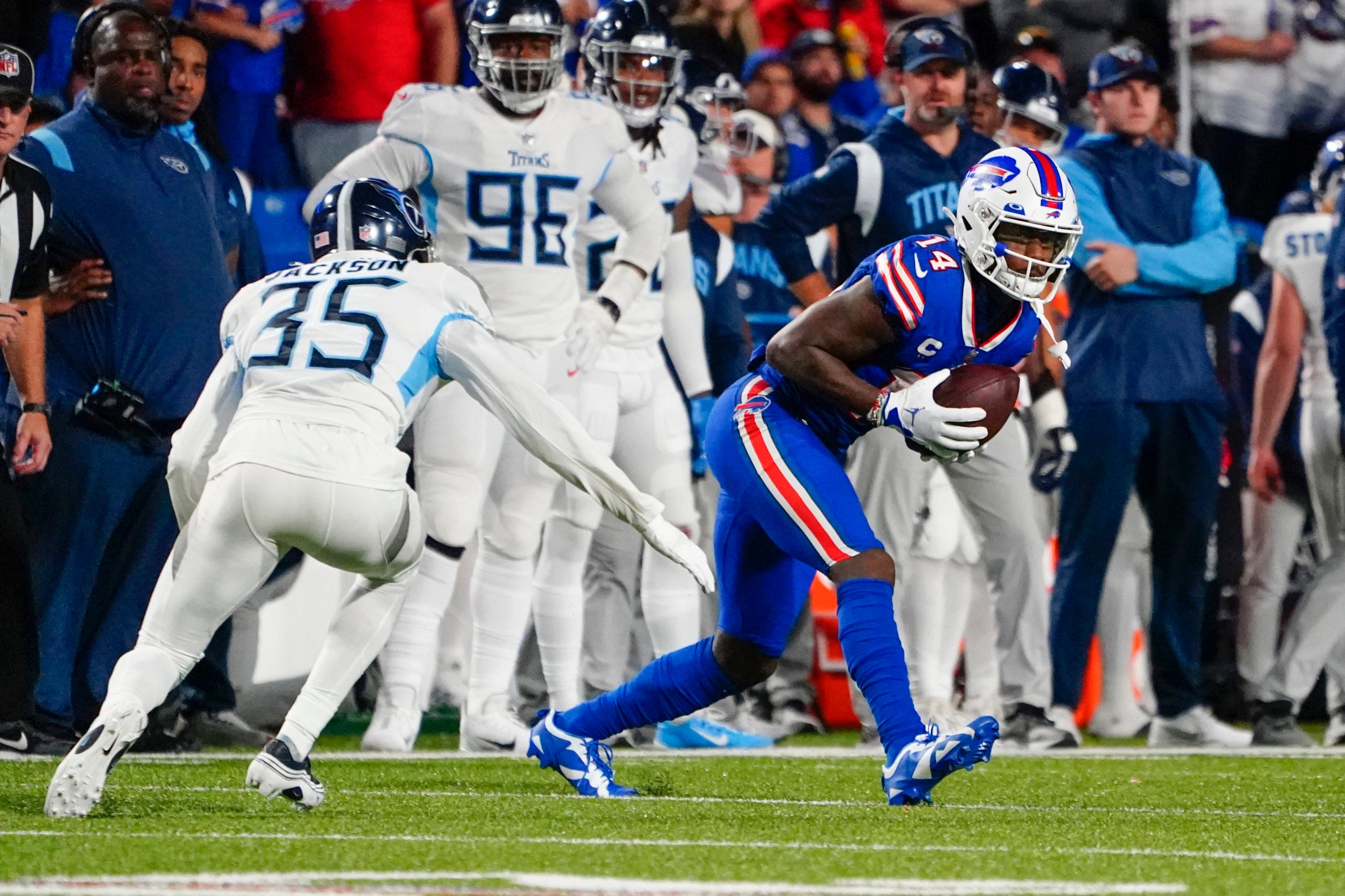 Sep 19, 2022; Orchard Park, New York, USA; Buffalo Bills wide receiver Stefon Diggs (14) catches a pass with Tennessee Titans cornerback Chris Jackson (35) defending during the second half at Highmark Stadium. Mandatory Credit: Gregory Fisher-USA TODAY Sports
