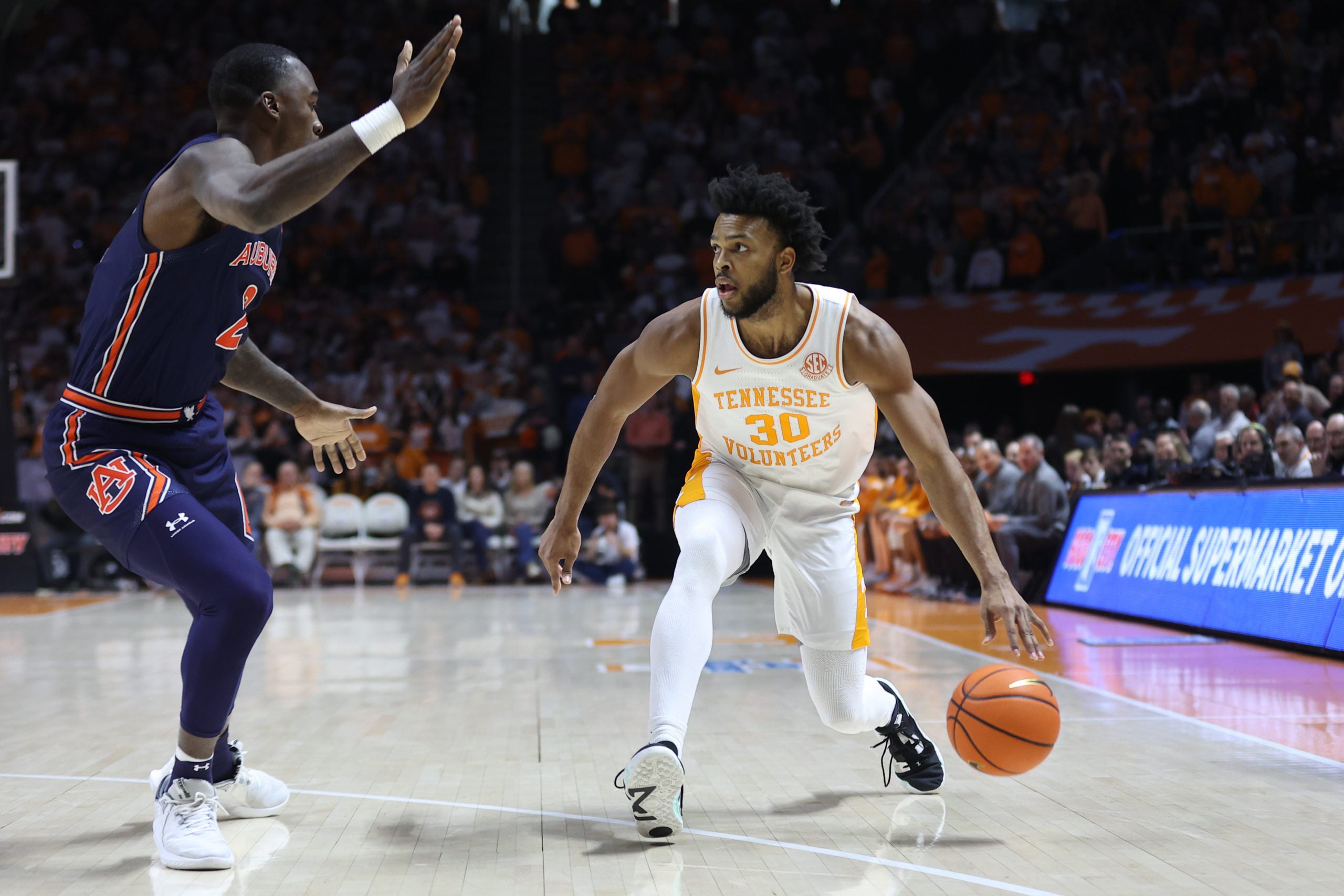 Feb 4, 2023; Knoxville, Tennessee, USA; Tennessee Volunteers guard Josiah-Jordan James (30) moves the ball against Auburn Tigers forward Jaylin Williams (2) during the first half at Thompson-Boling Arena. Mandatory Credit: Randy Sartin-USA TODAY Sports