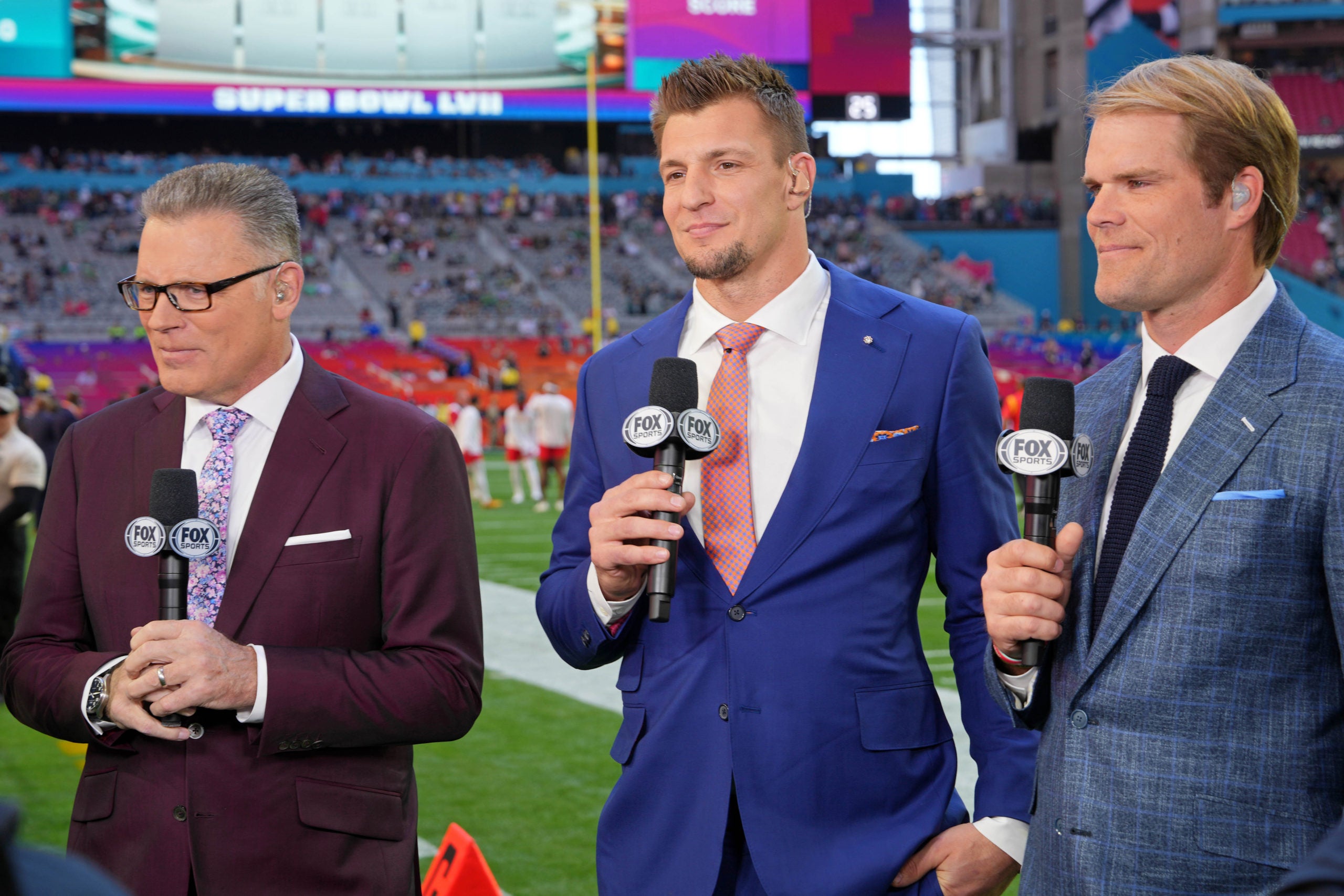 Feb 12, 2023; Glendale, Arizona, US; (Left to right) FOX Sports personalities Howie Long, Rob Gronkowski, and Greg Olsen before Super Bowl LVII at State Farm Stadium. Mandatory Credit: Kirby Lee-USA TODAY Sports