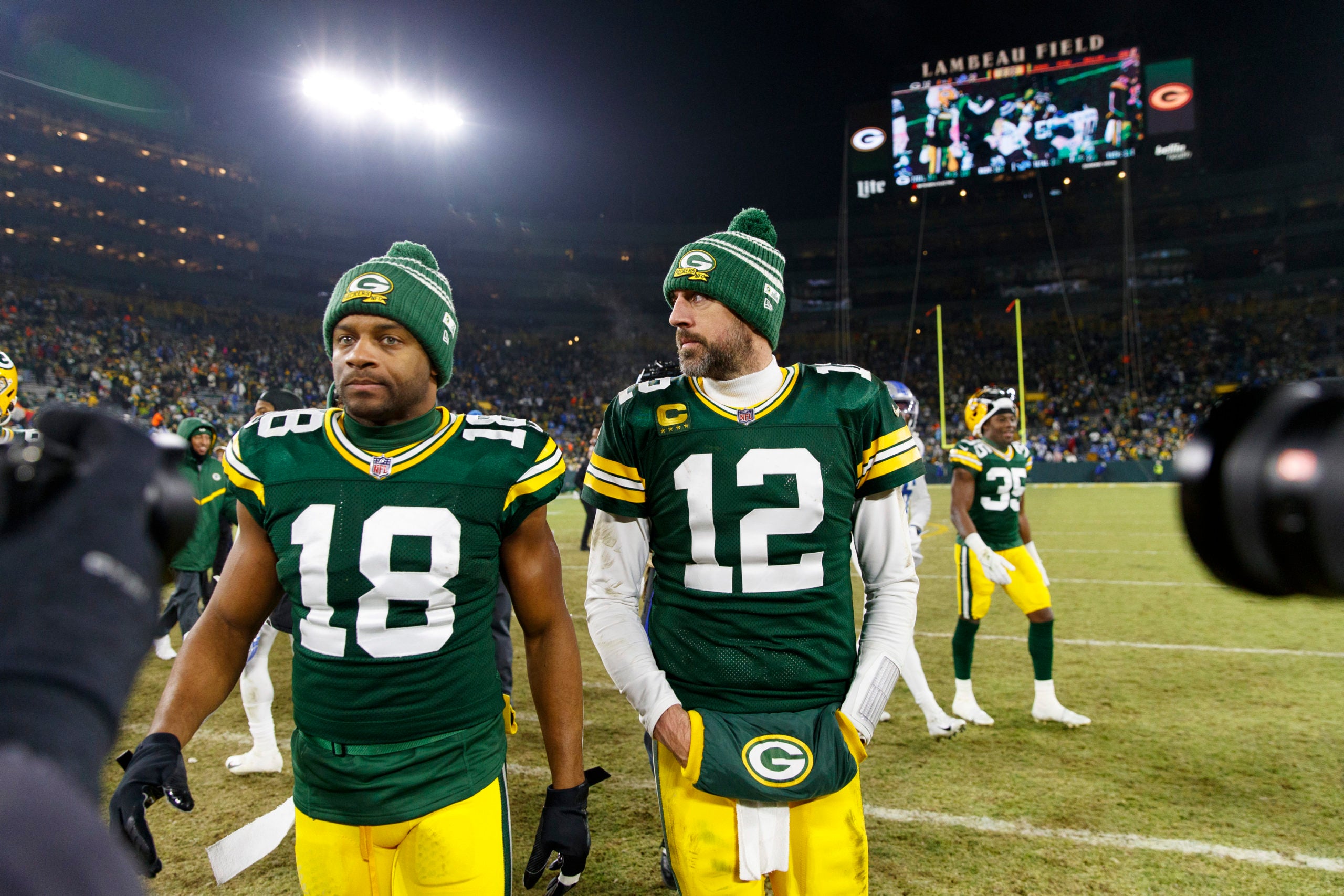 Jan 8, 2023; Green Bay, Wisconsin, USA;  Green Bay Packers quarterback Aaron Rodgers (12) and wide receiver Randall Cobb (18) walk off the field following the game against the Detroit Lions at Lambeau Field. Mandatory Credit: Jeff Hanisch-USA TODAY Sports
